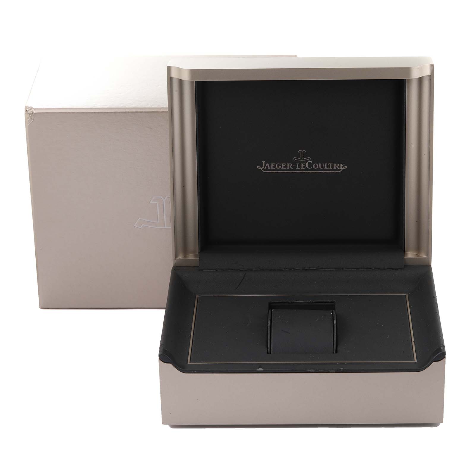 The image shows a Jaeger-LeCoultre Reverso watch box with the lid open, displaying the brand logo.