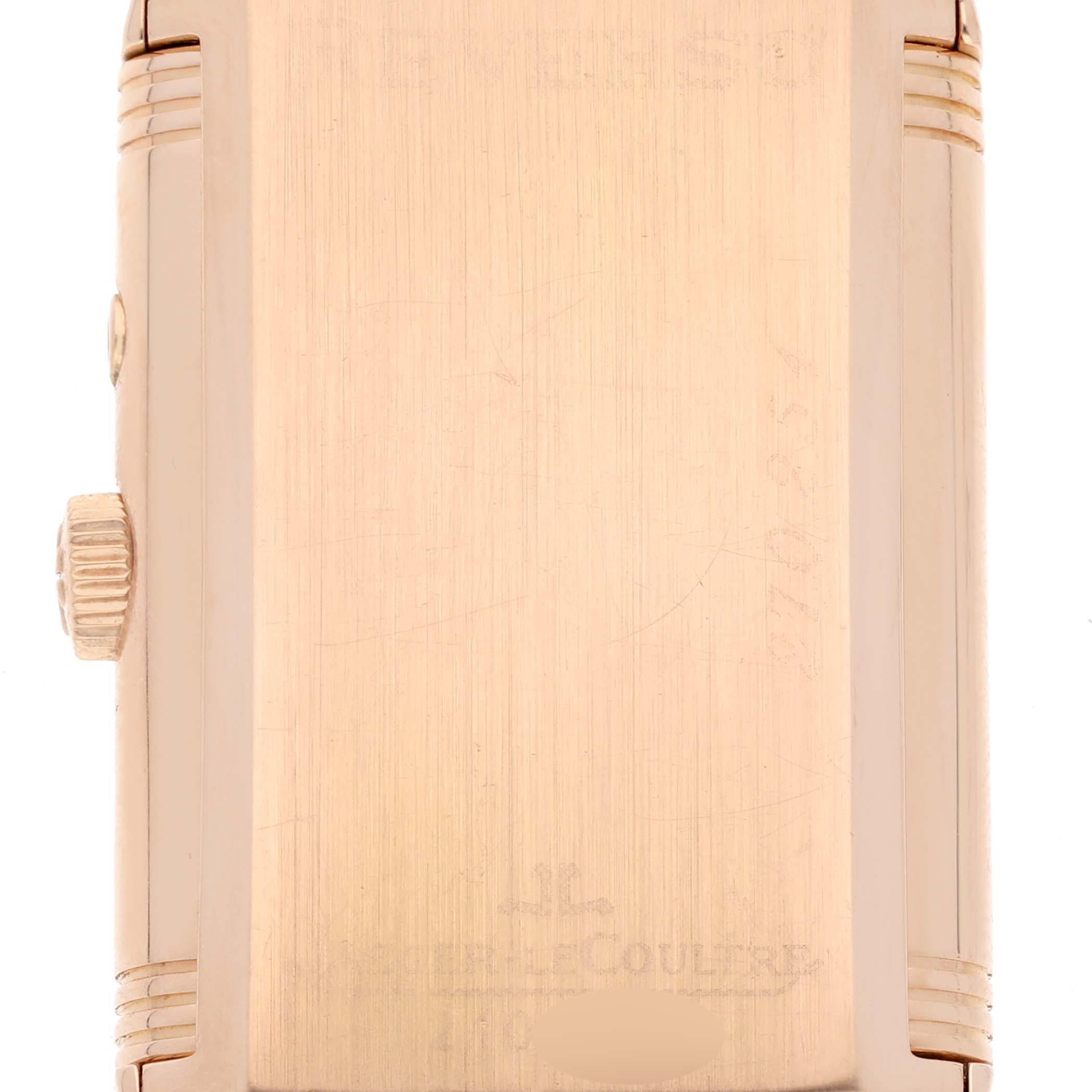 This is an image of the Reverso model by Jaeger LeCoultre showing the case back and the crown from a side angle.