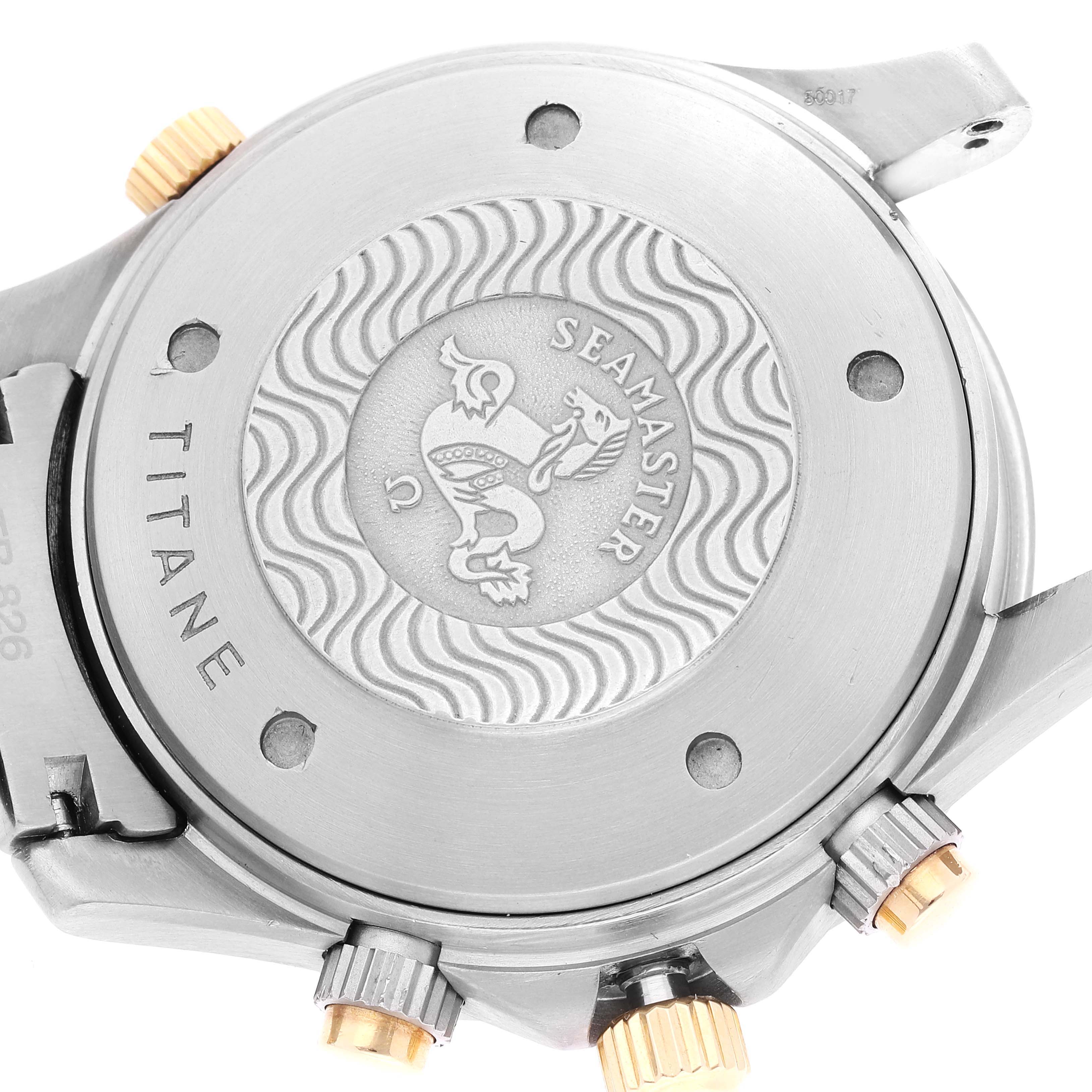 The image shows the back case and crown of an Omega Seamaster 2297.80.00 Men's Titanium Blue Dial 2297.80.00 Men's Titanium Blue Dial watch, emphasizing the engraved emblem and branding.