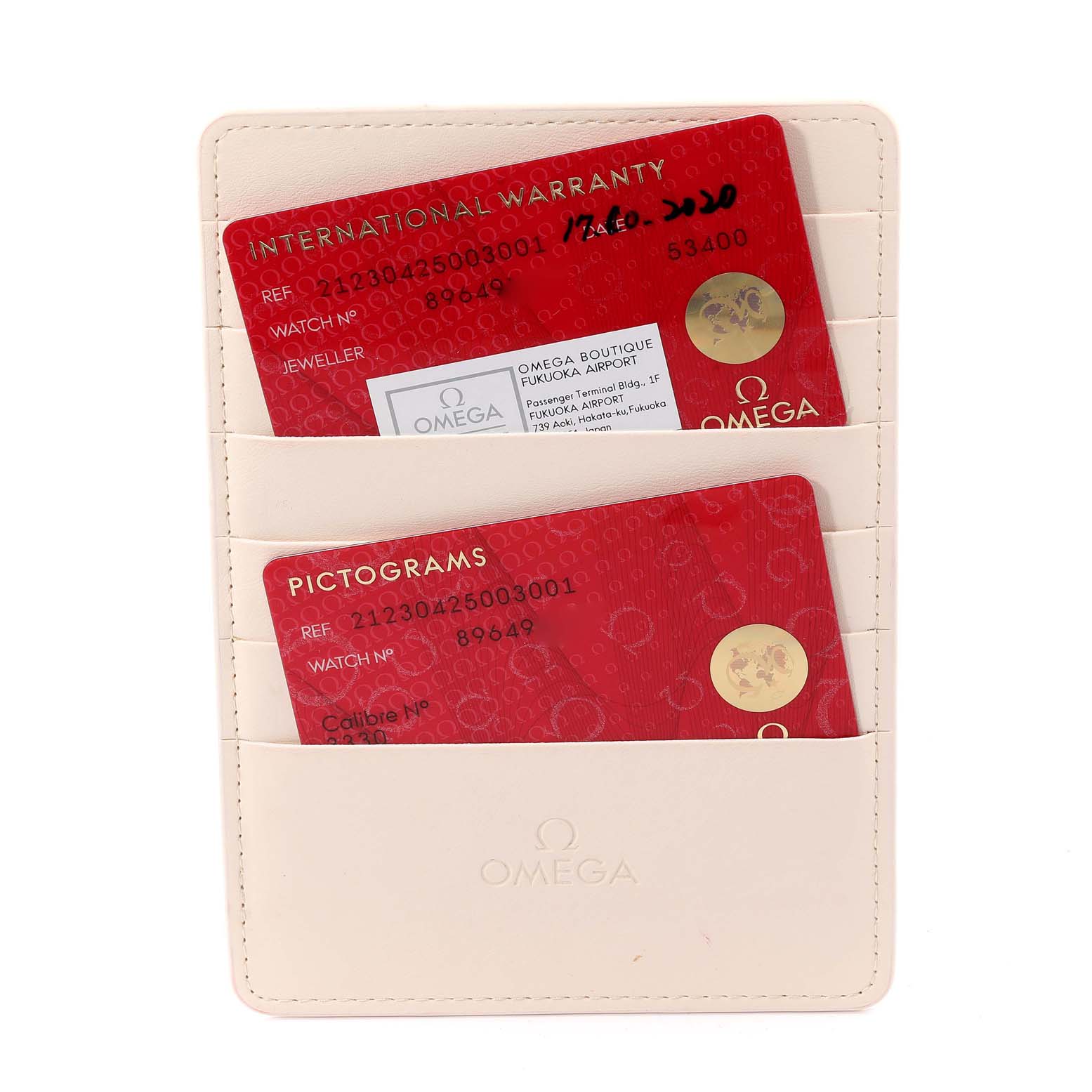 This image shows Omega Seamaster 212.30.42.50.03.001 Men's Stainless Steel Blue Dial 212.30.42.50.03.001 Men's Stainless Steel Blue Dial model warranty and pictogram cards in a white cardholder.