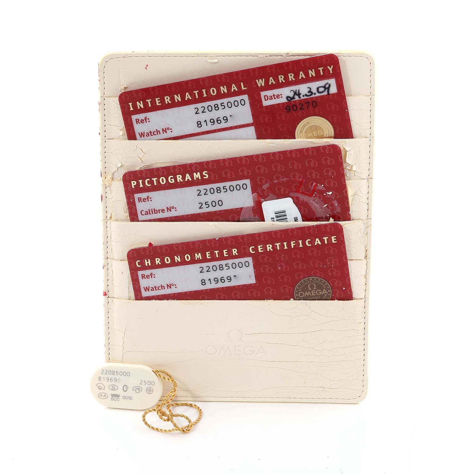 The image shows the Omega Planet Ocean 2208.50.00 Men
s Stainless Steel Black Dial 2208.50.00 Men
s Stainless Steel Black Dial watch
s international warranty, pictograms, chronometer certificate, and a tag in a card holder.