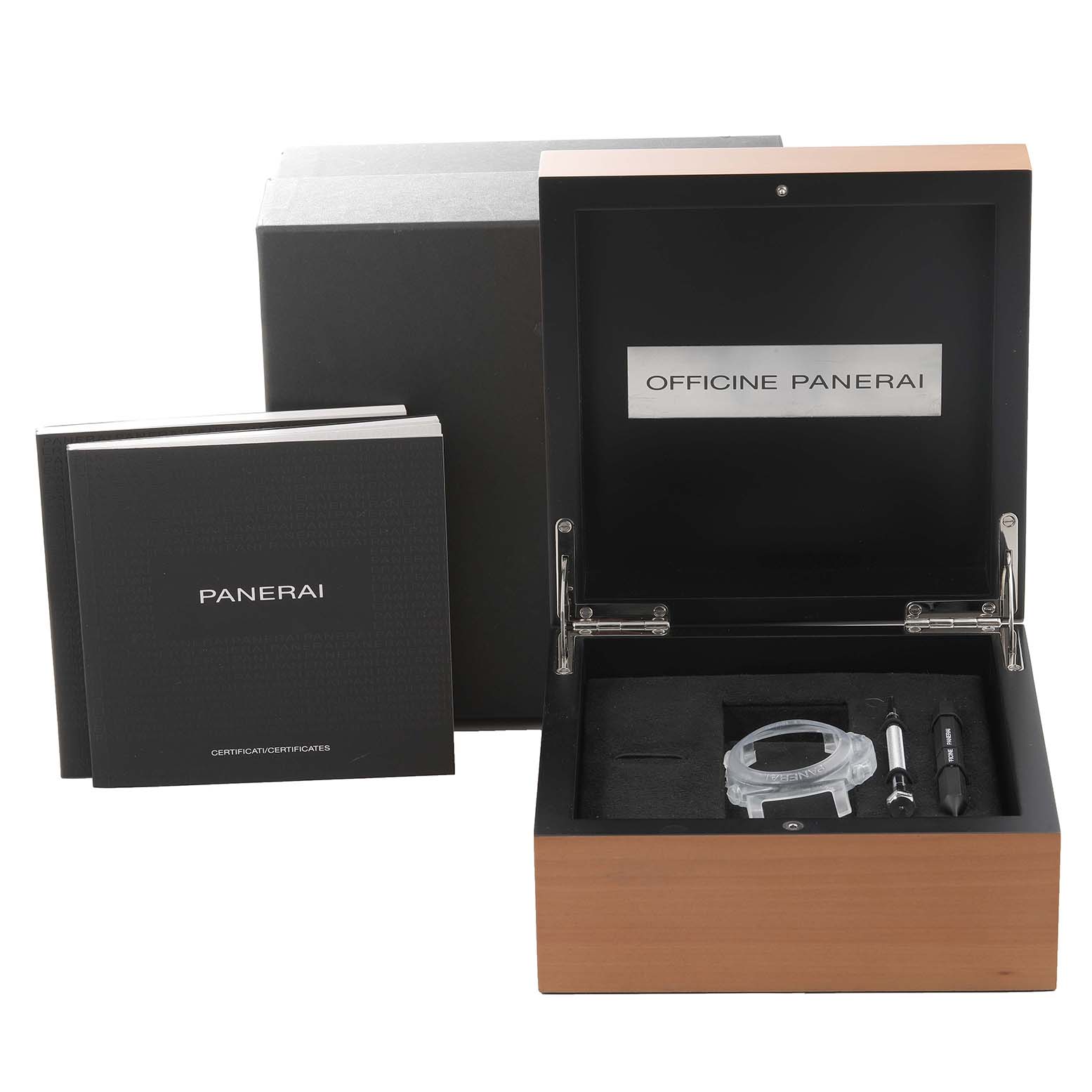 The image shows an open box for a Panerai Luminor PAM00233 Men
s Stainless Steel Black Dial PAM00233 Men
s Stainless Steel Black Dial, containing tools and the watch case, with accompanying manuals beside it.