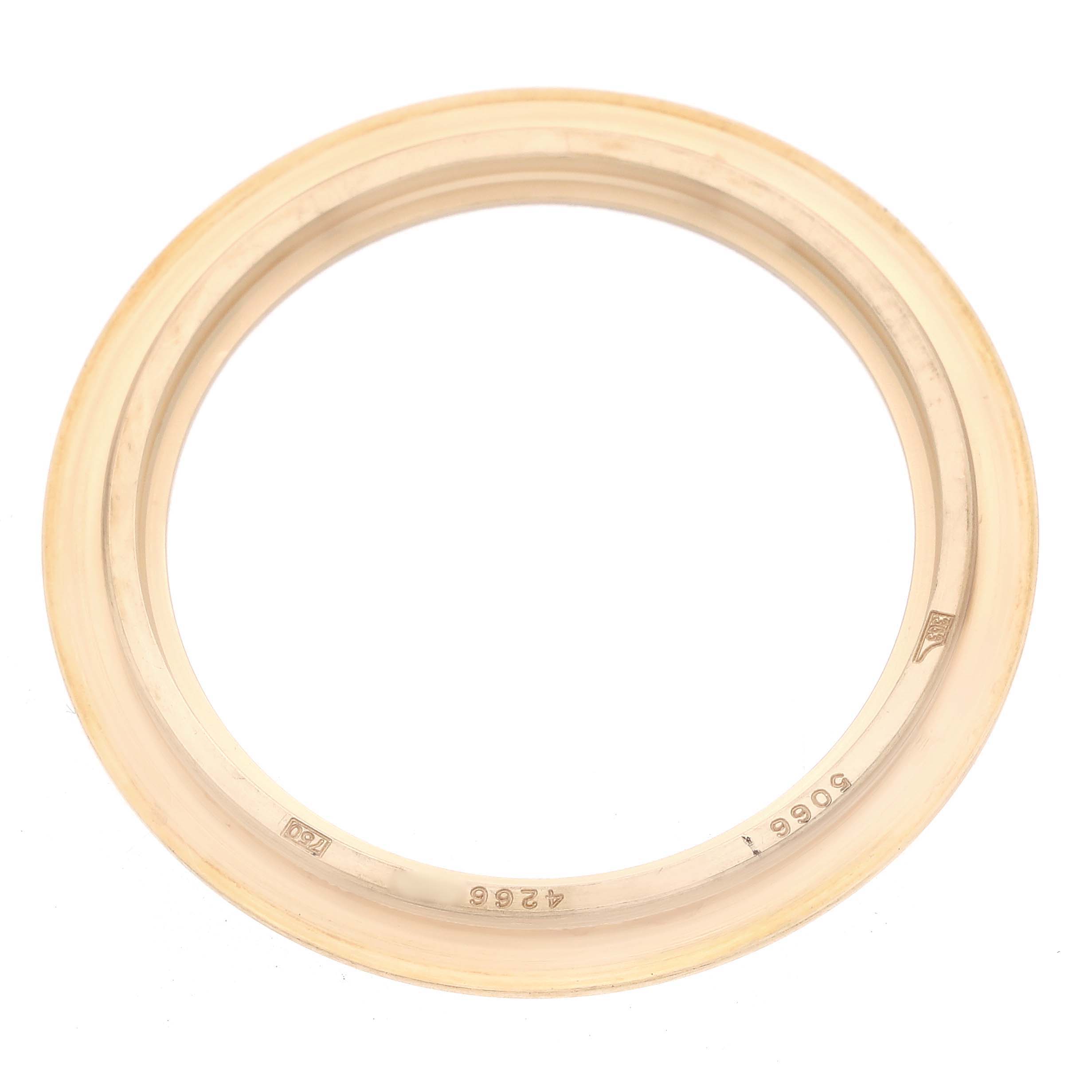 This image shows a bezel for a Patek Philippe Aquanaut 5066J Men
s Yellow Gold Black Dial watch from a top-down view.