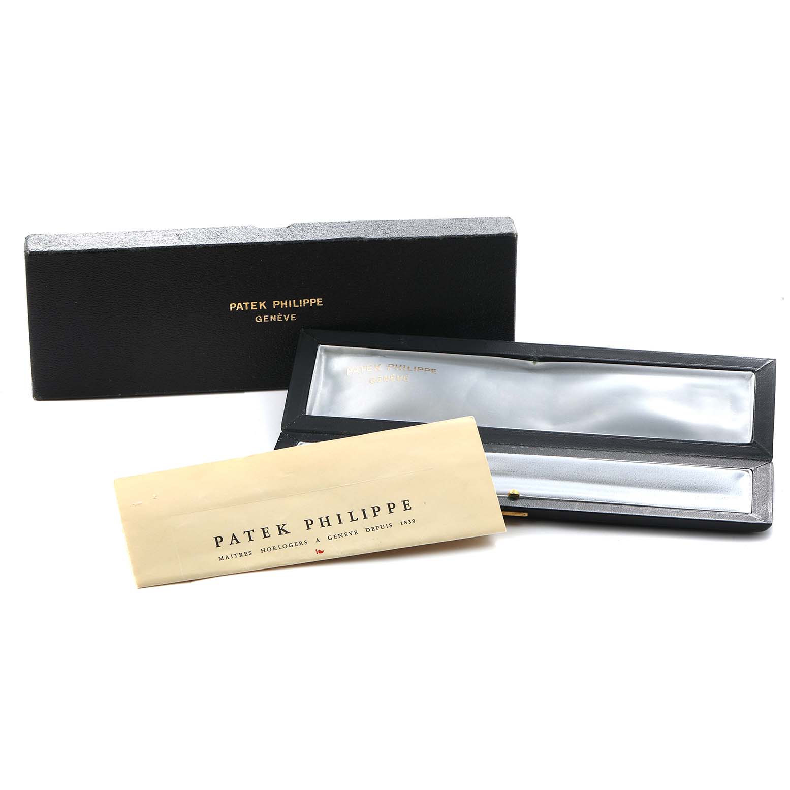 The image shows a Patek Philippe Vintage 3553/1 Men
s White Gold Silver Dial watch box and papers, including a closed and open box with a branded envelope.