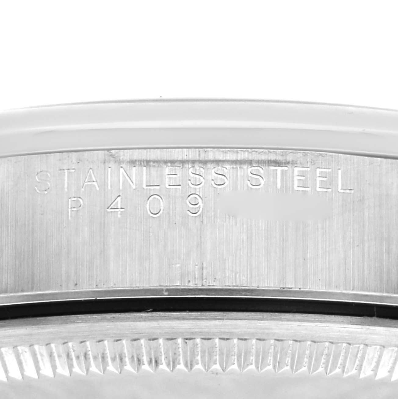 This is a close-up of the side of the Rolex Air-King 14000 Men's Stainless Steel Blue Dial 14000 Men's Stainless Steel Blue Dial watch case, showing the "STAINLESS STEEL" engraving and the model number.