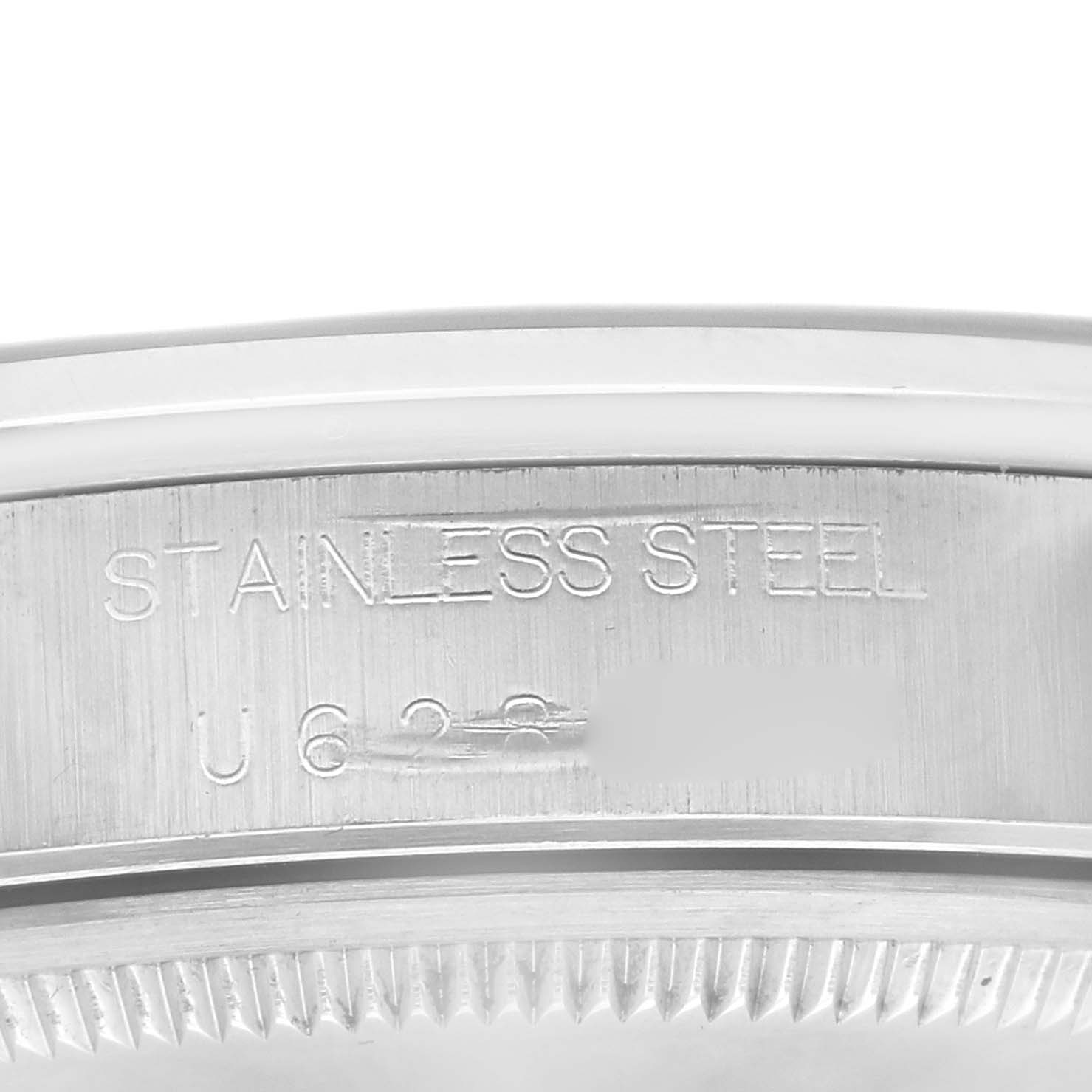 This close-up image shows the side engraving on the stainless steel case of a Rolex Air-King 14000 Men's Stainless Steel Pink Dial 14000 Men's Stainless Steel Pink Dial watch.