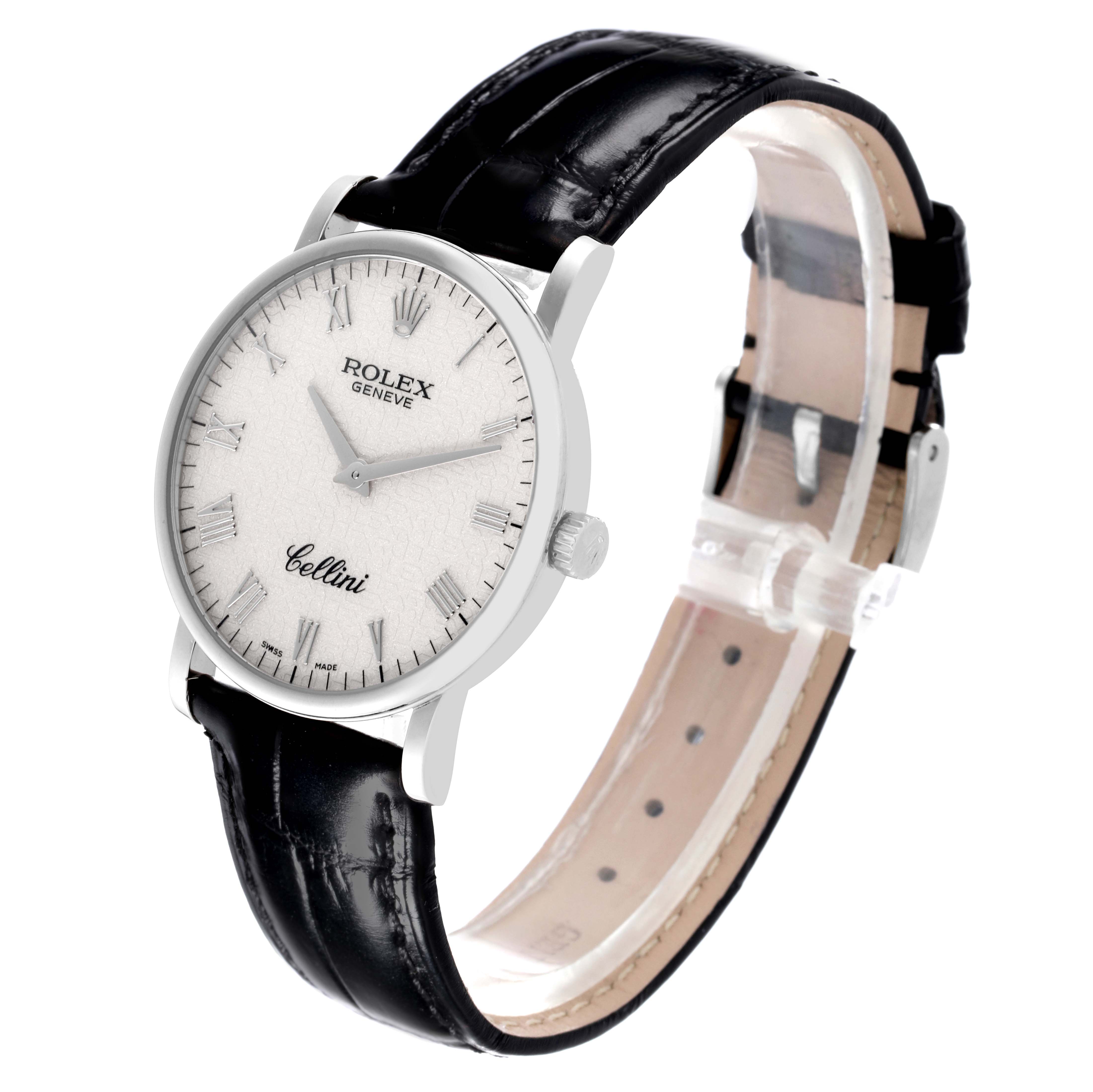 The image shows a side angle of the Rolex Cellini 5115/9 Men's White Gold White Dial 5115/9 Men's White Gold White Dial watch featuring its face, bezel, crown, and black leather strap.