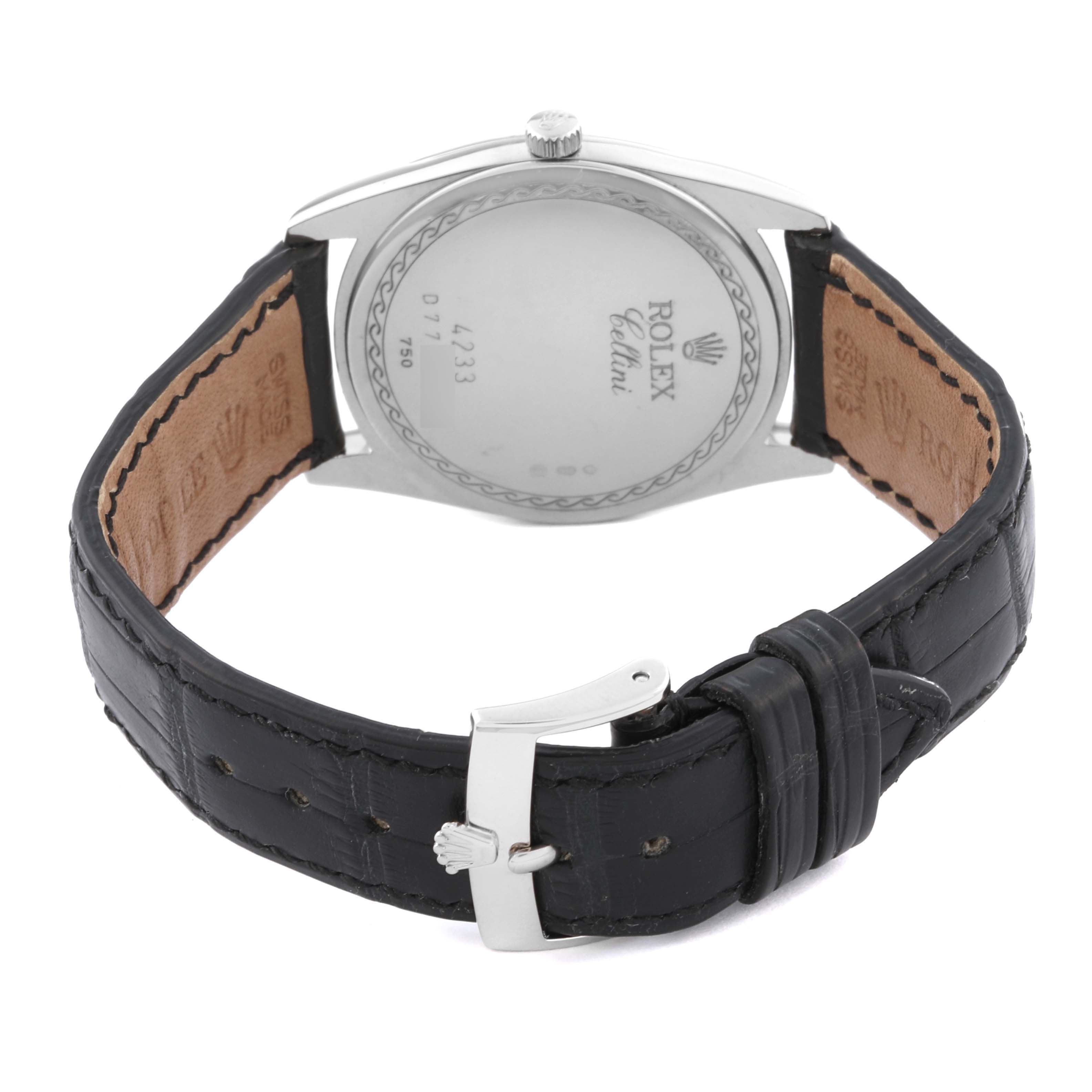 The image shows the back view of a Rolex Cellini 4233/9 Men's White Gold White Dial 4233/9 Men's White Gold White Dial model watch, highlighting its leather strap and buckle.