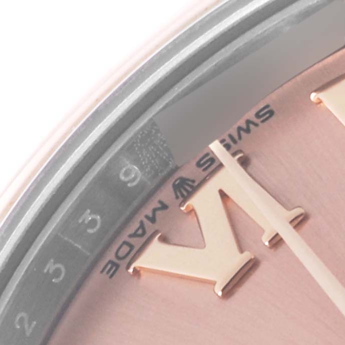 This image shows a close-up of the dial and partial date indicator of a Mid-Size Rolex watch.