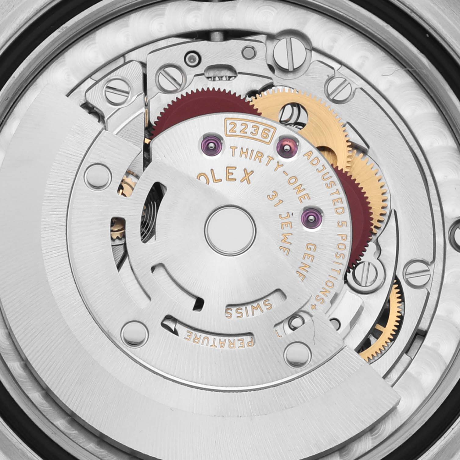 A close-up view of the movement and inner mechanism of a Rolex Mid-Size 278241 Women's Steel and Gold (two tone) Pink Dial 278241 Women's Steel and Gold (two tone) Pink Dial watch model 2236 is shown.
