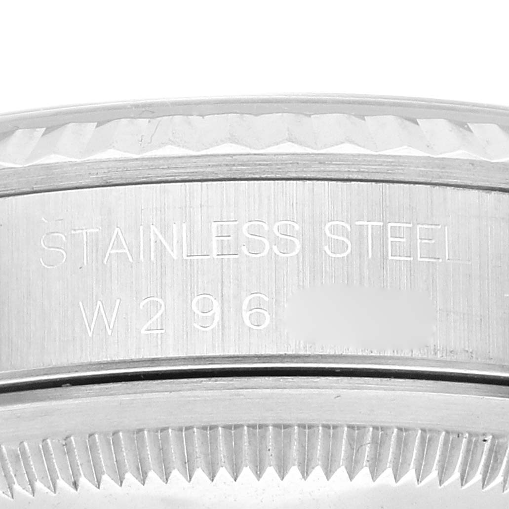 The image shows a close-up angle of the stainless steel case back of a Rolex Datejust 16234 Men's Stainless Steel Pink Dial 16234 Men's Stainless Steel Pink Dial watch, highlighting the serial number and metal type engraving.