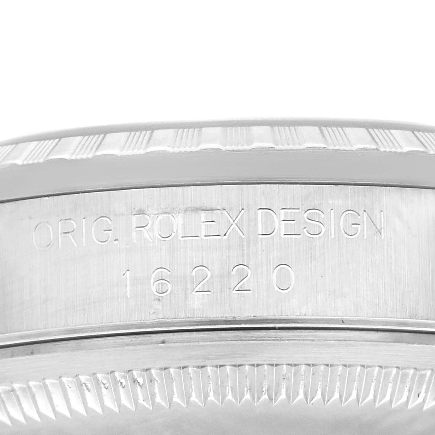 The image shows a close-up of the engraving on the side of the Rolex Datejust 16220 Men
s Stainless Steel White Dial 16220 Men
s Stainless Steel White Dial case, displaying the model number 16220.