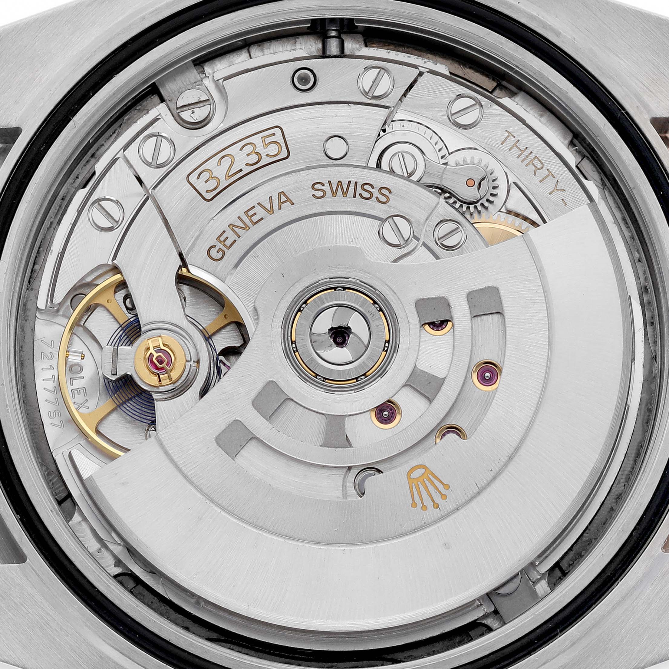 The image shows the intricate internal movement and mechanism of a Rolex Datejust 41 126331 Men's Steel and Gold (two tone) Grey Dial 126331 Men's Steel and Gold (two tone) Grey Dial model, highlighting its caliber 3235.