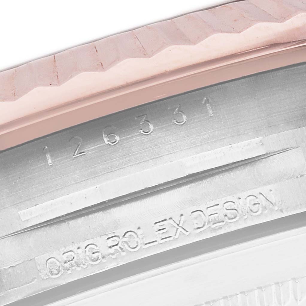 This close-up image shows the fluted bezel and engraved inner rim of the Rolex Datejust 41 126331 Men's Steel and Gold (two tone) Grey Dial 126331 Men's Steel and Gold (two tone) Grey Dial watch.