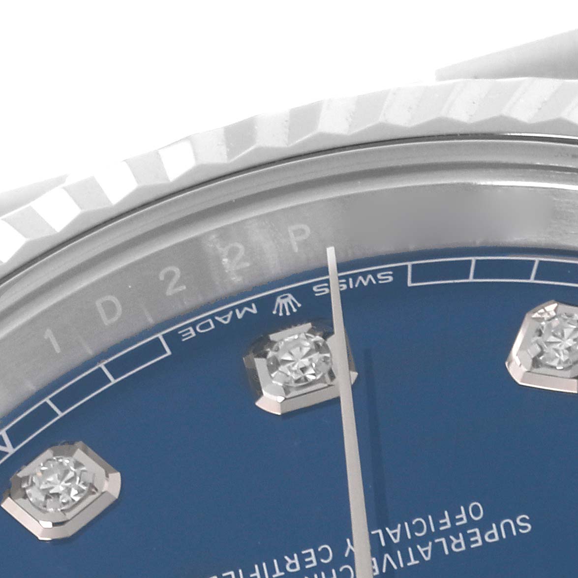 This close-up of a Rolex Datejust 41 126334 Men
s Stainless Steel Blue Dial 126334 Men
s Stainless Steel Blue Dial shows the upper part of the dial with diamond hour markers and the "SWISS MADE" label.
