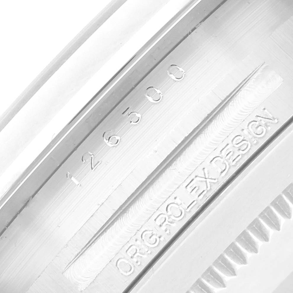 The image shows the engraved model number and "ORIG ROLEX DESIGN" text, likely on the case back edge of a Rolex Datejust 41 126300 Men
s Stainless Steel Grey Dial.