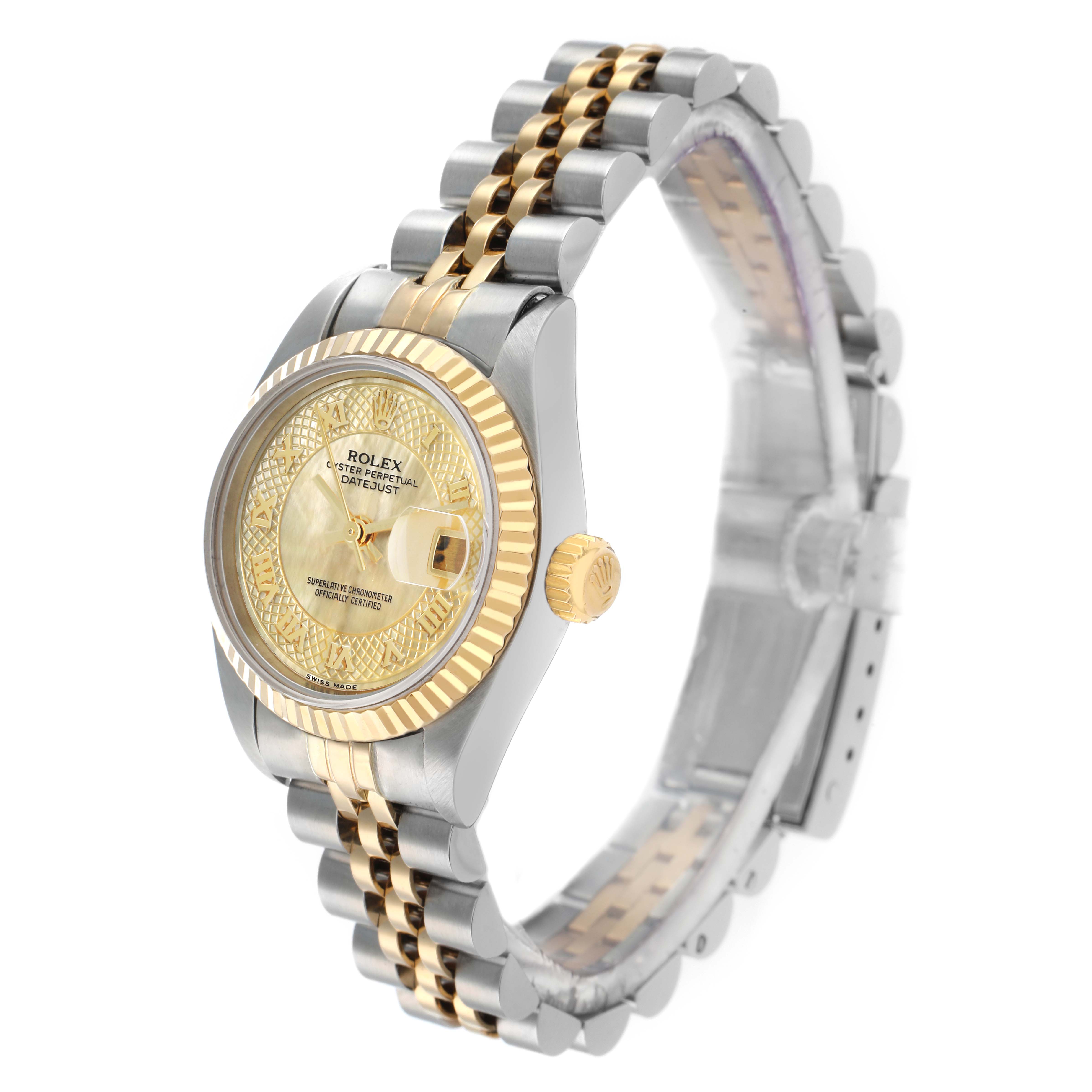 The Rolex Datejust 79173 Women
s Steel and Gold (two tone) Mother of Pearl Dial is shown at an angled side view, highlighting its gold and silver bracelet, bezel, and dial.