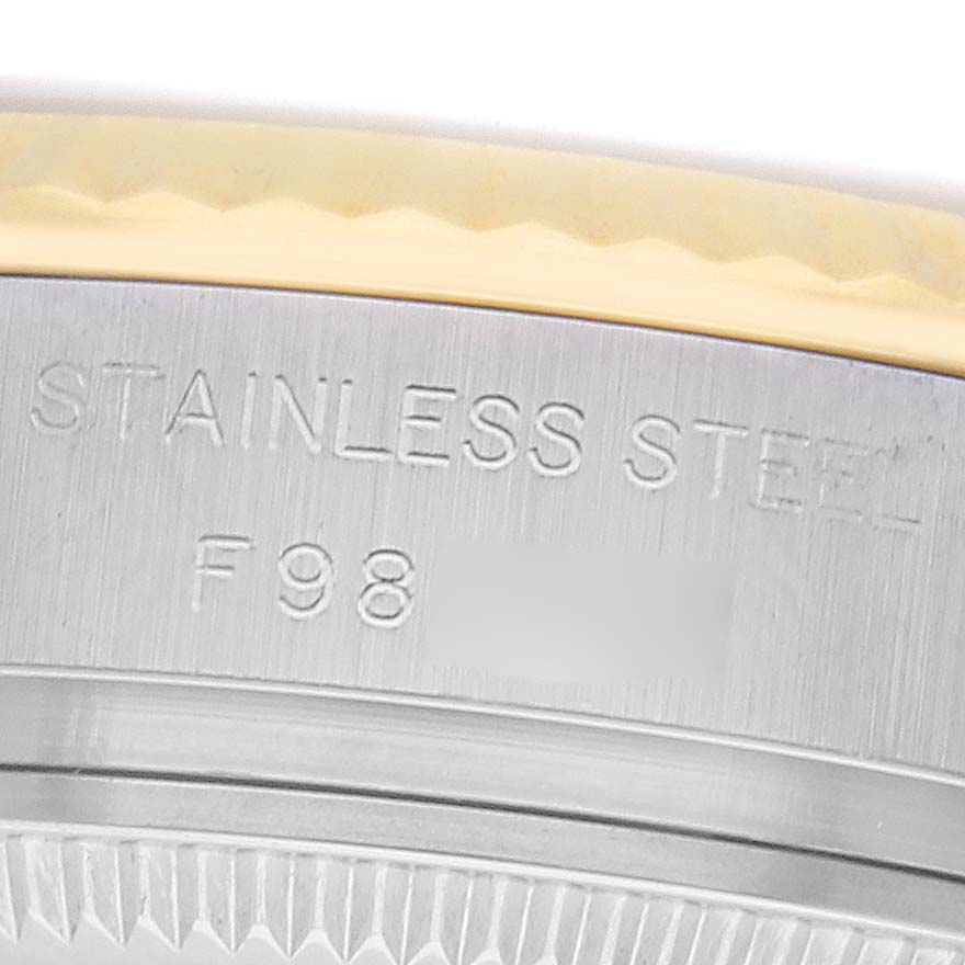 The image shows a close-up of the case back engraving on a Rolex Datejust 179173 Women
s Steel and Gold (two tone) Champagne Dial, highlighting the "STAINLESS STEEL" text.