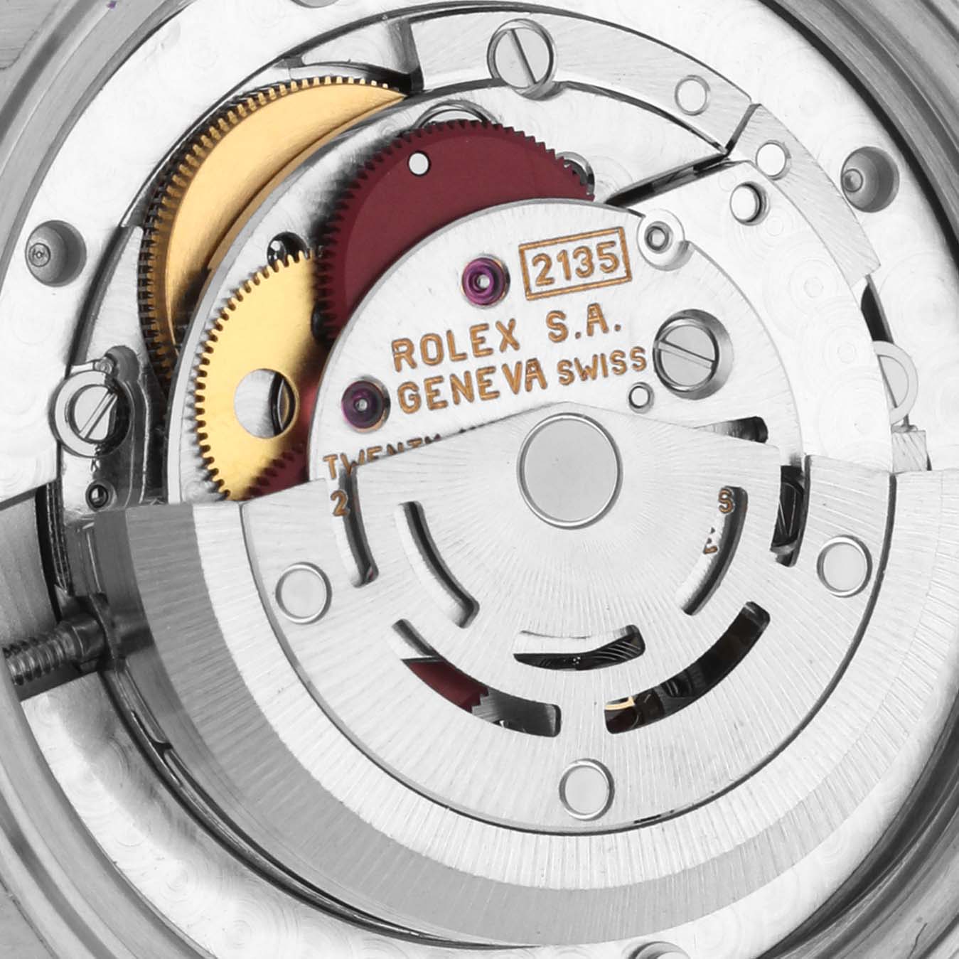 This image shows a close-up view of the internal mechanism (caliber 2135) of a Mid-Size Rolex watch.