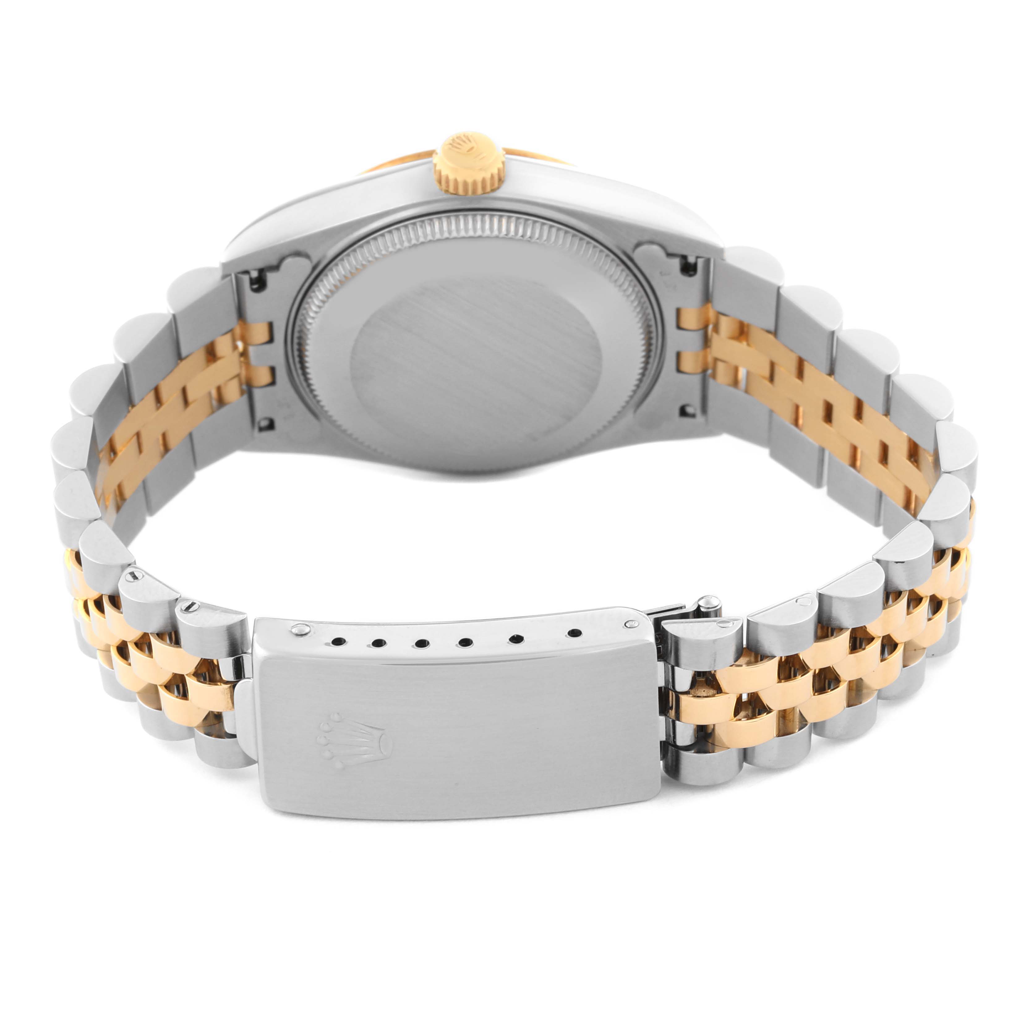 This image shows the back of a Mid-Size Rolex watch, highlighting the case back, bracelet, and closure clasp.