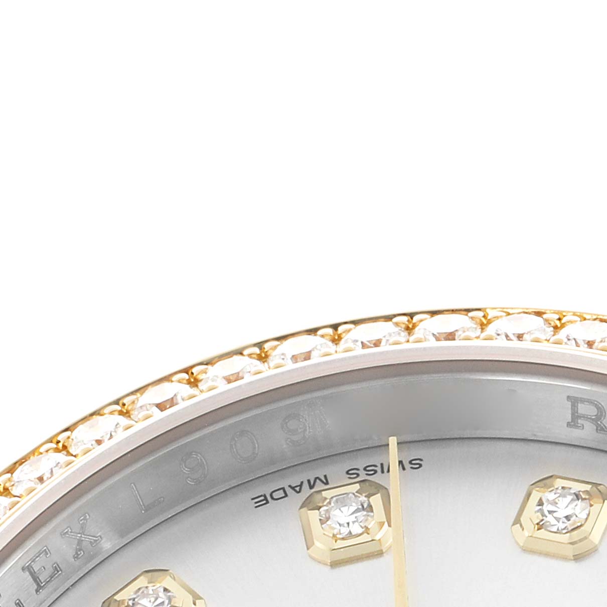 The image shows a close-up of the Rolex Datejust 116243 Men
s Steel and Gold (two tone) Silver Dial watch, featuring the bezel with diamonds and partial view of the dial with hour markers.
