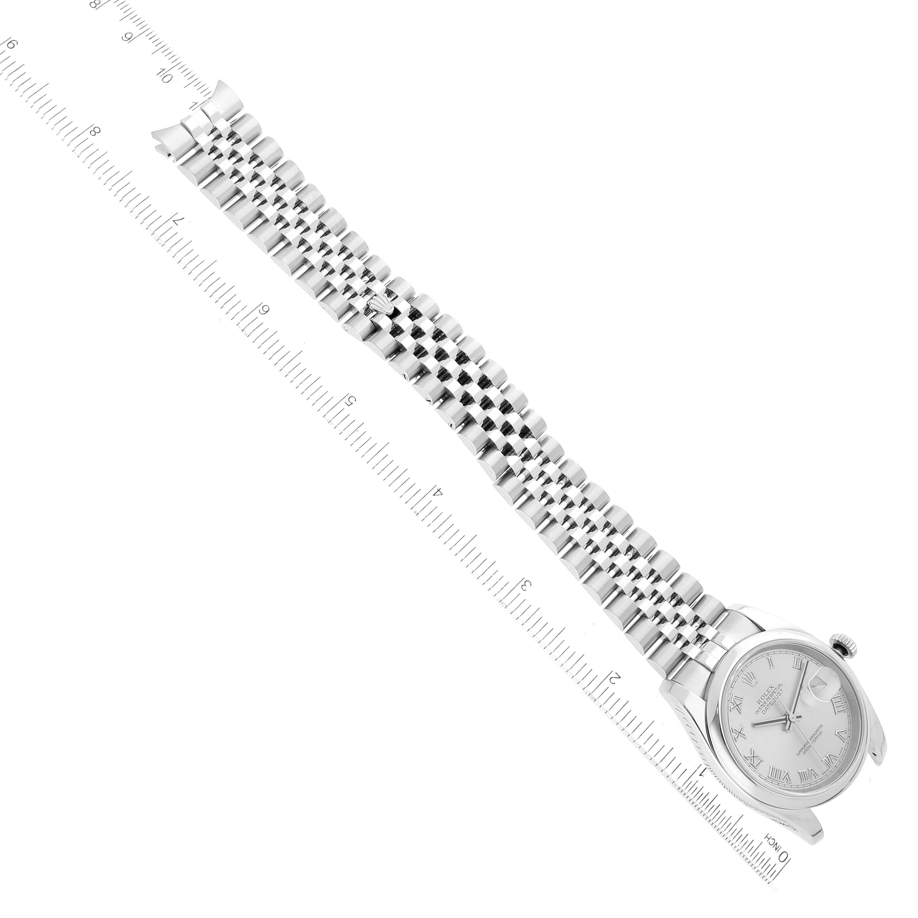 This image shows a Rolex Datejust 116200 Men's Stainless Steel Silver Dial 116200 Men's Stainless Steel Silver Dial watch from top view, featuring the dial and full bracelet aligned with a ruler.