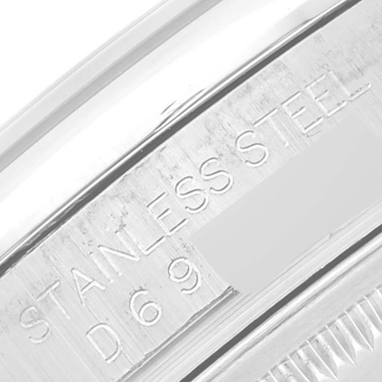This image shows an engraved inner bezel ring of a Rolex Datejust 116200 Men's Stainless Steel Silver Dial 116200 Men's Stainless Steel Silver Dial watch, indicating "STAINLESS STEEL" and part of the model number.