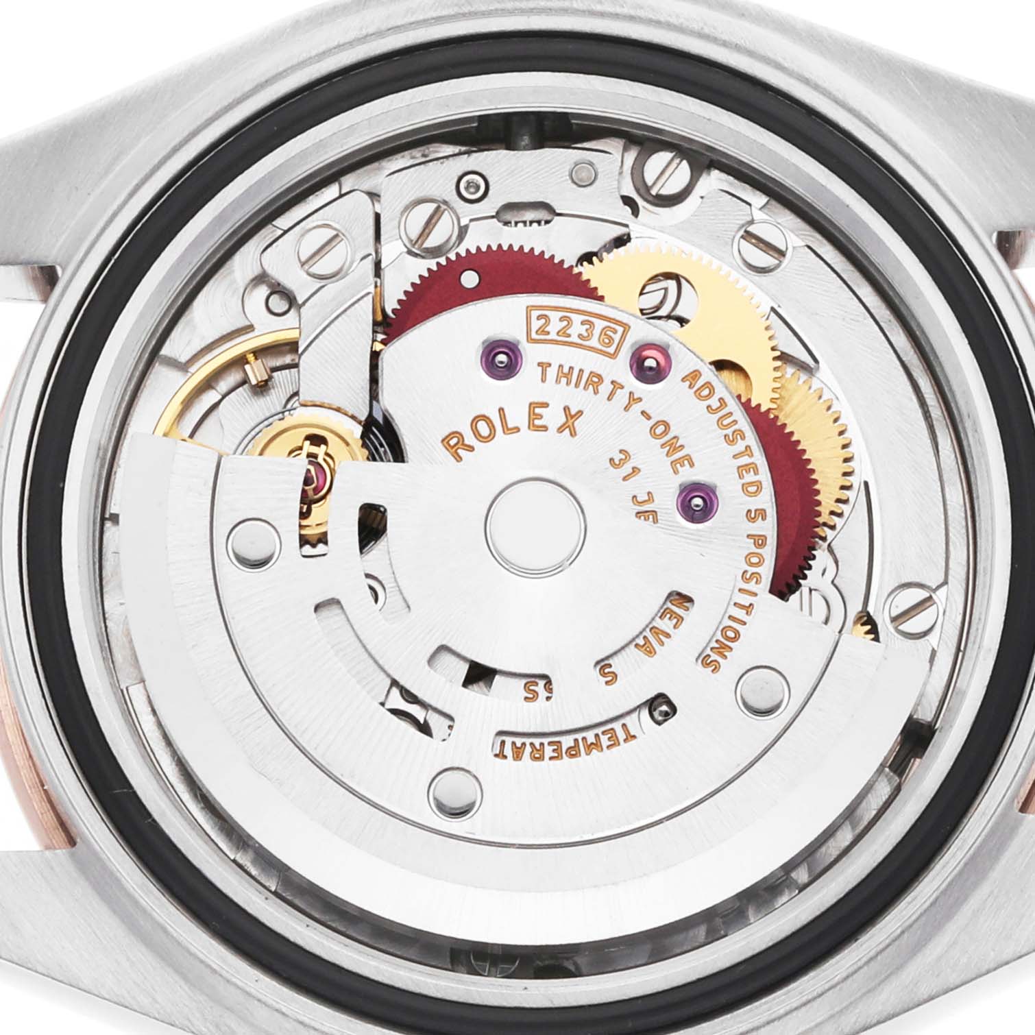 The image shows the movement of the Rolex Datejust 279171 Women
s Steel and Gold (two tone) Silver Dial from a back angle, highlighting gears and mechanical components.