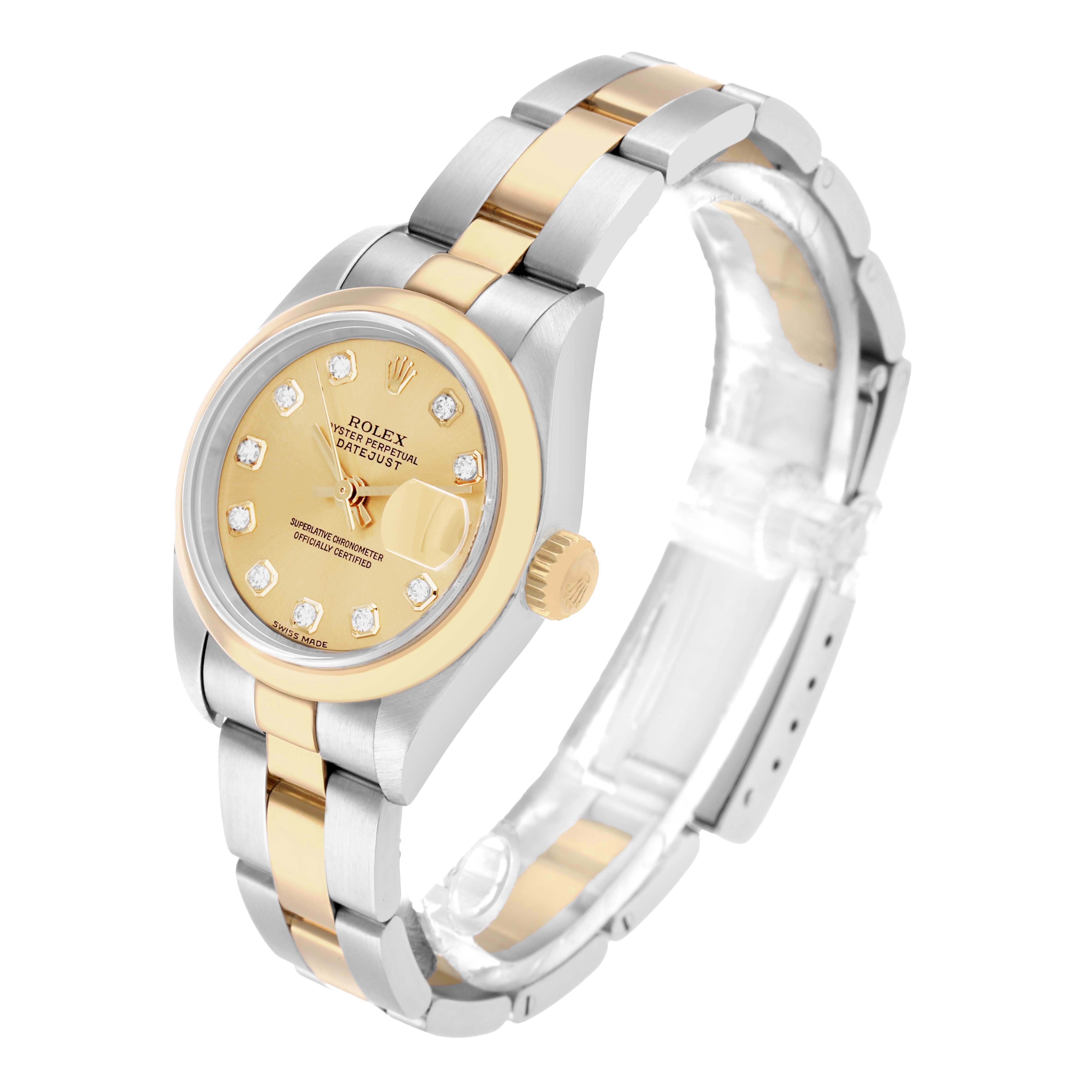 The Rolex Datejust 79163 Women
s Steel and Gold (two tone) Champagne Dial watch is shown at a right-side angle, displaying the bracelet, dial, and crown.