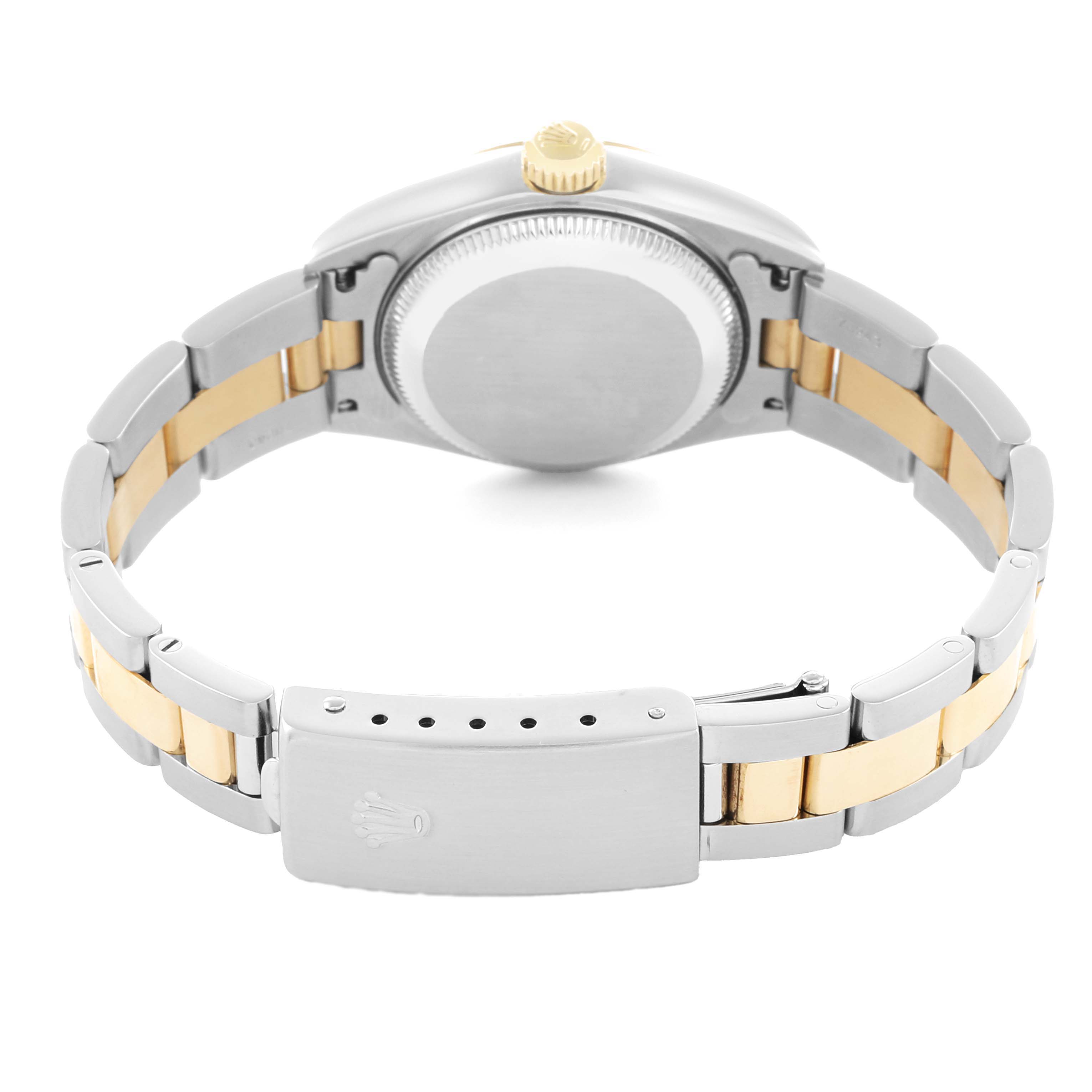 The image shows the backside of a Rolex Datejust 79163 Women
s Steel and Gold (two tone) Champagne Dial watch, highlighting the clasp, bracelet, and caseback.