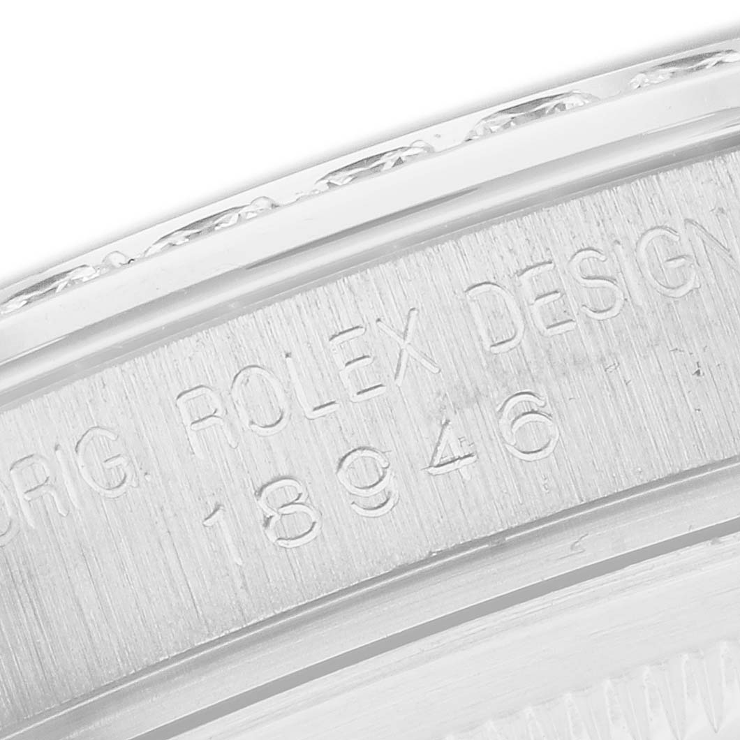 The image shows a close-up of the case edge with engravings on a Rolex Pearlmaster 18946 Men
s Platinum Mother of Pearl Dial watch.