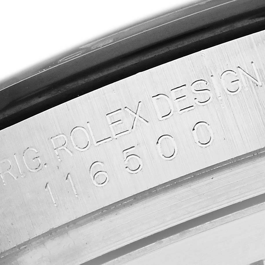 The image shows a close-up of the engraving on the case of a Rolex Daytona 116500 Men
s Stainless Steel Black Dial watch.