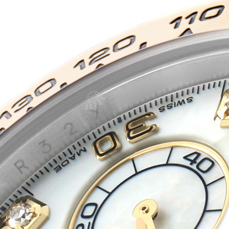 The image shows a close-up of the Rolex Daytona 116503 Men
s Steel and Gold (two tone) Mother of Pearl Dial watch, highlighting the bezel
s tachymetric scale and part of the dial with numerals.