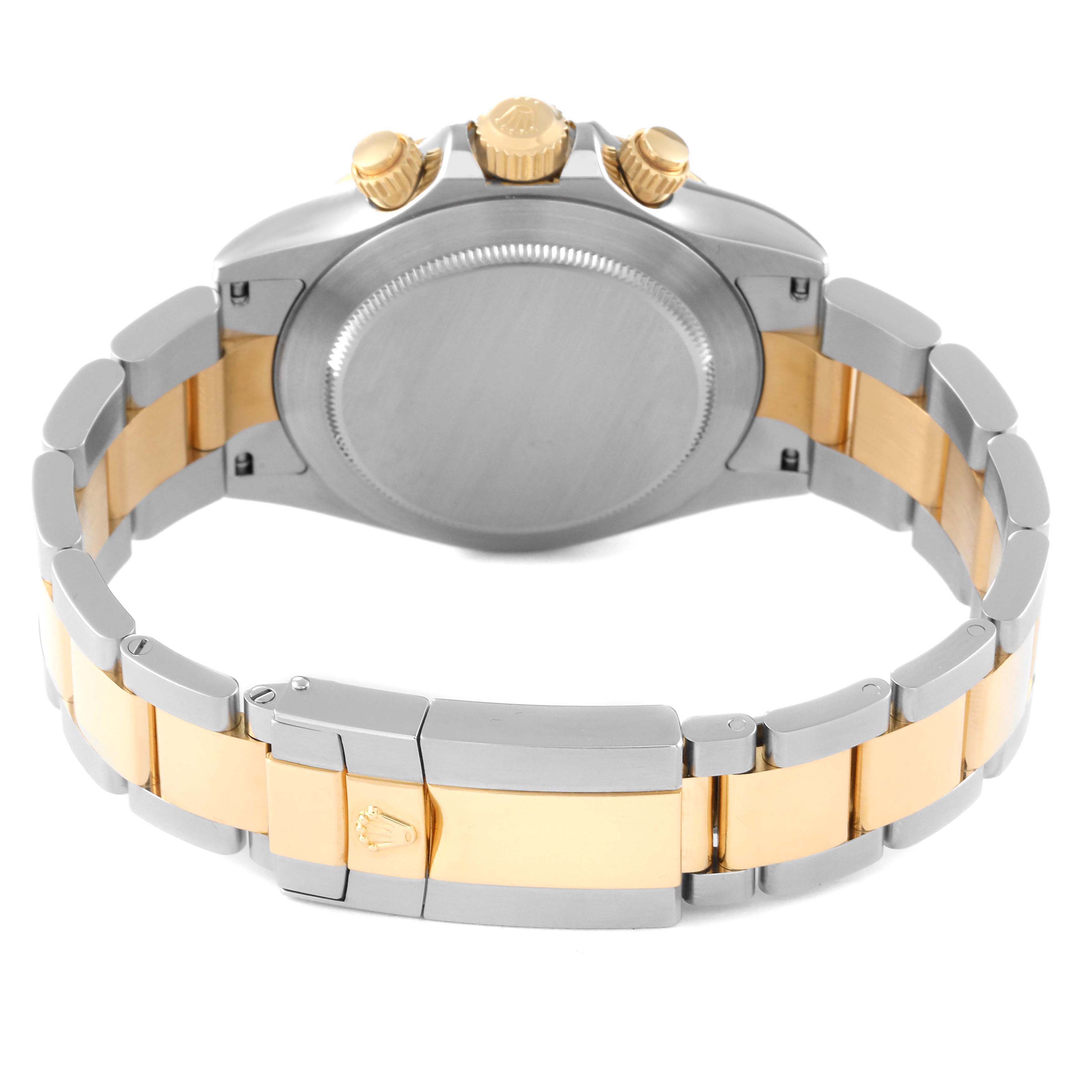 The image shows the back view of a Rolex Daytona 116523 Men's Steel and Gold (two tone) Silver Dial 116523 Men's Steel and Gold (two tone) Silver Dial watch, highlighting its clasp, case back, and crown.