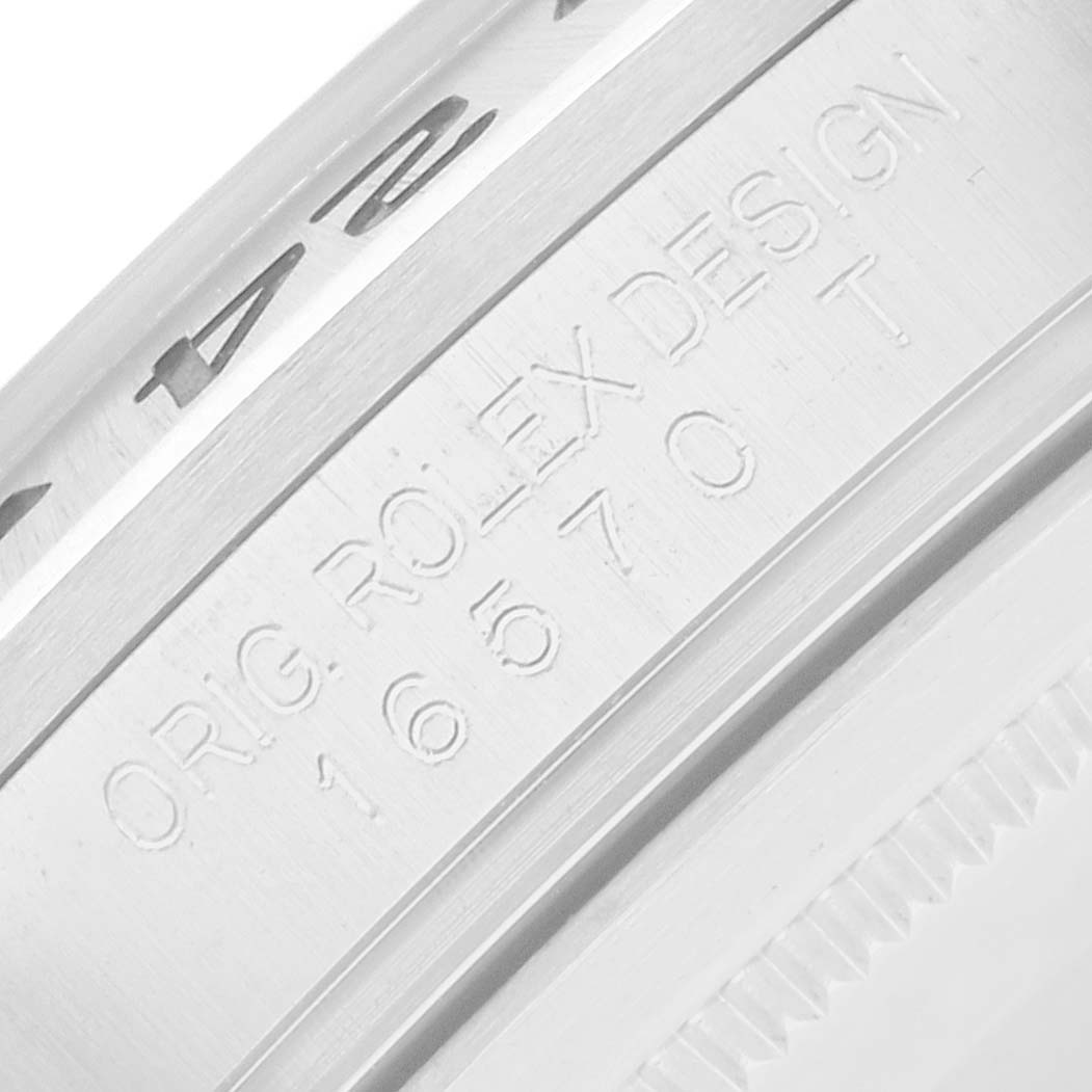 The image shows a close-up of the side of the Rolex Explorer 16570 Men
s Stainless Steel Black Dial, highlighting the engraved model details.