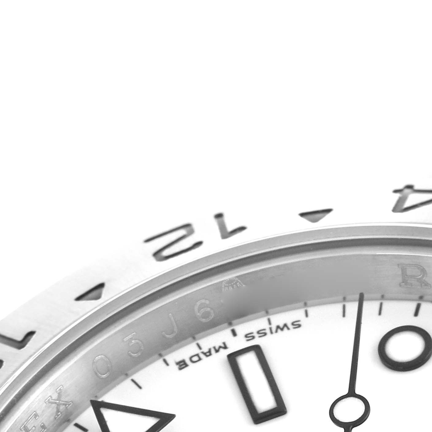 This image shows a close-up of the bezel and dial of a Rolex Explorer 16570 Men
s Stainless Steel White Dial, highlighting the numerals and part of the hand.