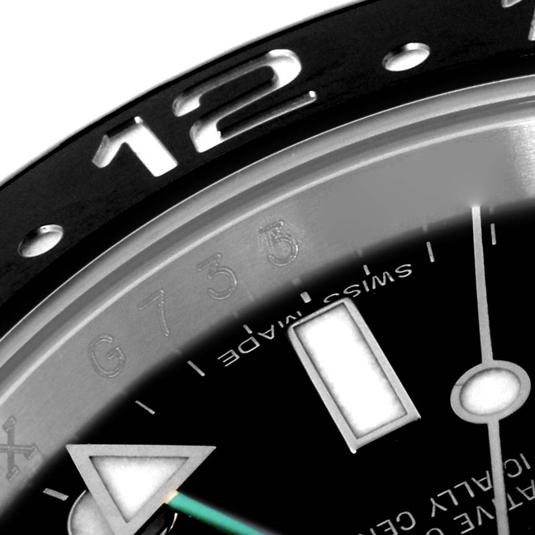 The image shows a close-up of the bezel, part of the dial, and the indicating triangle of the Rolex GMT-Master 116710 Men
s Stainless Steel Black Dial 116710 Men
s Stainless Steel Black Dial watch.