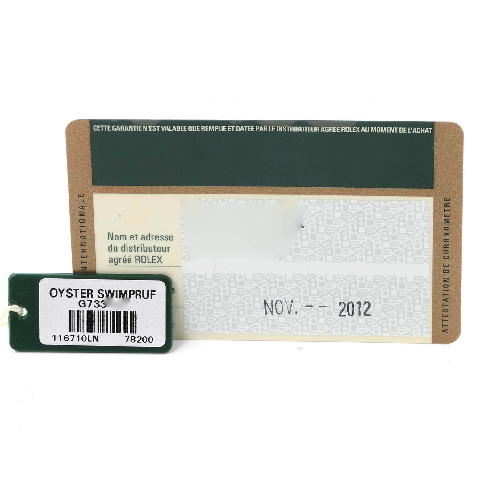 This image shows warranty and identification accessories for a Rolex GMT-Master 116710 Men
s Stainless Steel Black Dial 116710 Men
s Stainless Steel Black Dial, including an Oyster Swimpruf tag.