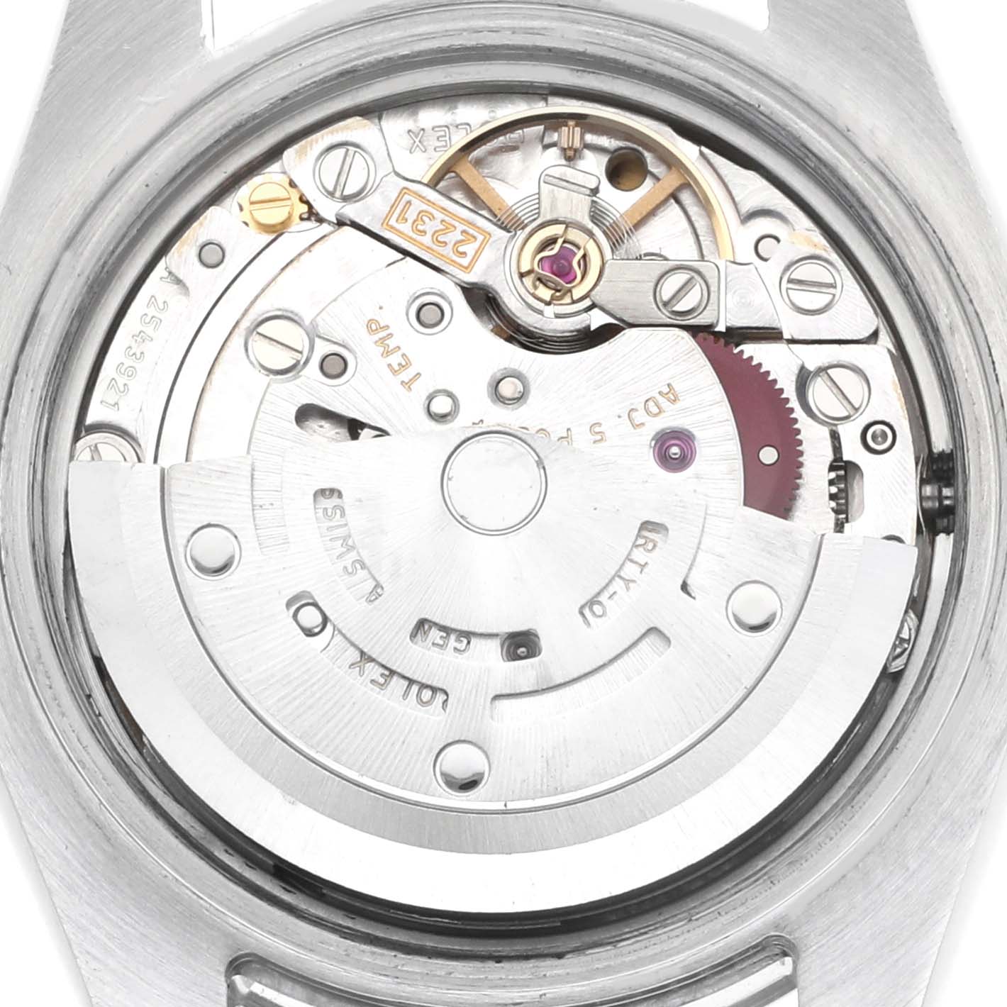 The image shows a close-up of the movement of a Rolex Oyster Perpetual 176200 Women
s Stainless Steel Black Dial watch from the back, highlighting internal mechanics.