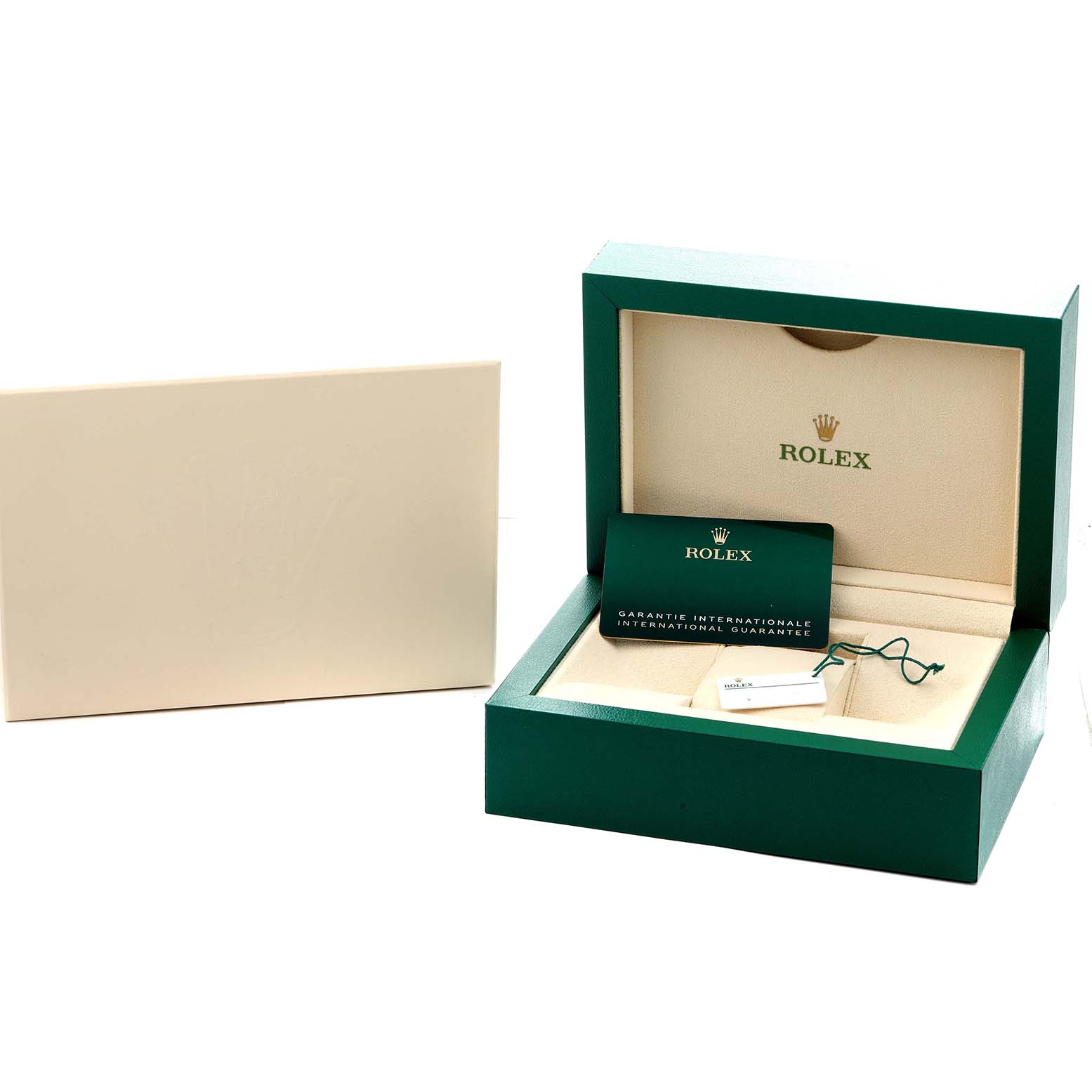 The image shows a Rolex Air-King 126900 Men
s Stainless Steel Black Dial box and papers, including a green warranty card and a green box with a beige interior.