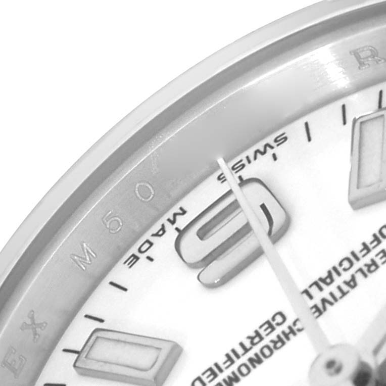 The image shows a close-up of the dial and bezel of a Rolex Oyster Perpetual 176200 Women
s Stainless Steel White Dial watch, highlighting the "9" and "SWISS MADE" text.