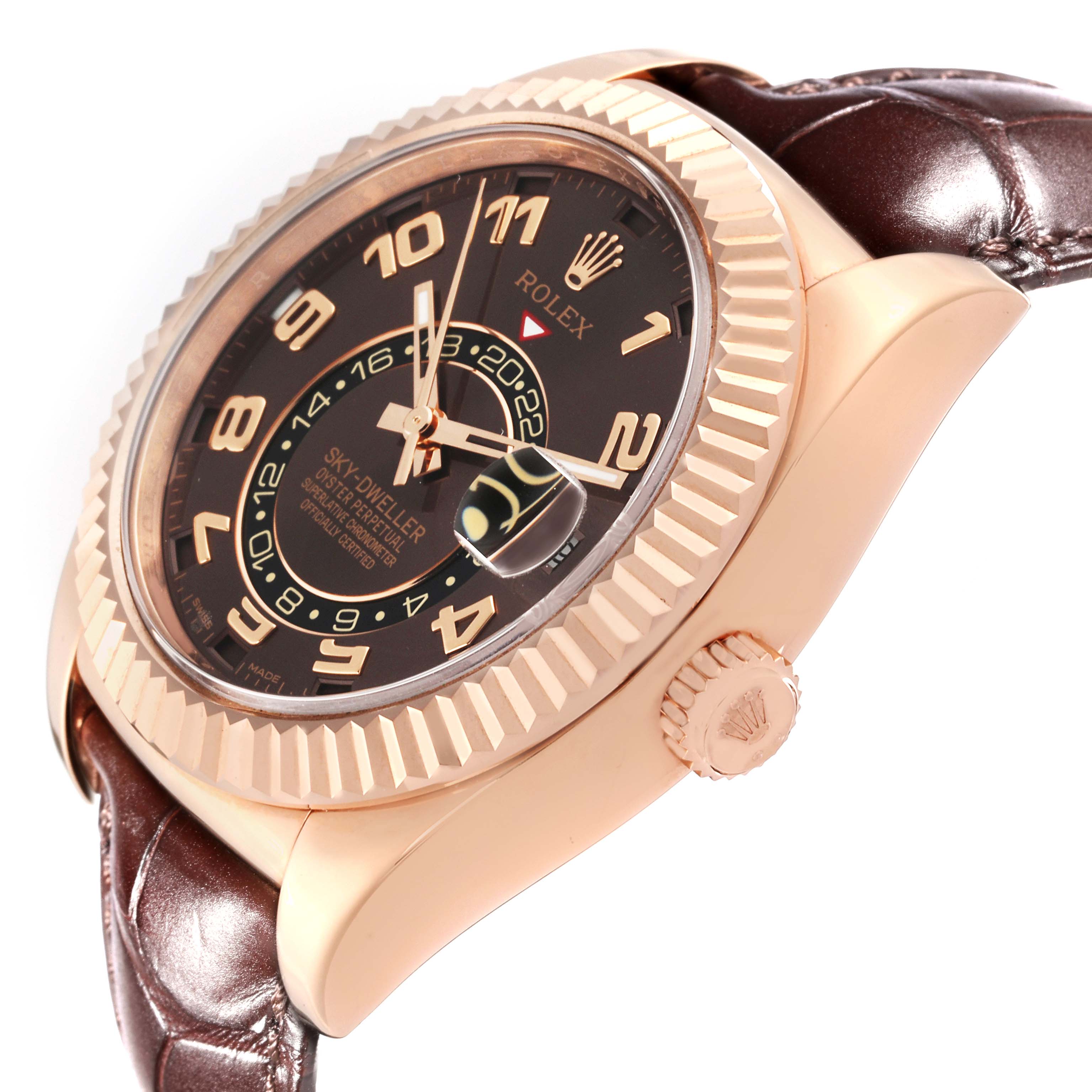 This image shows a Rolex Sky-Dweller 326135 Men
s Rose Gold Brown Dial 326135 Men
s Rose Gold Brown Dial watch at an angle highlighting the bezel, dial, crown, and leather strap.