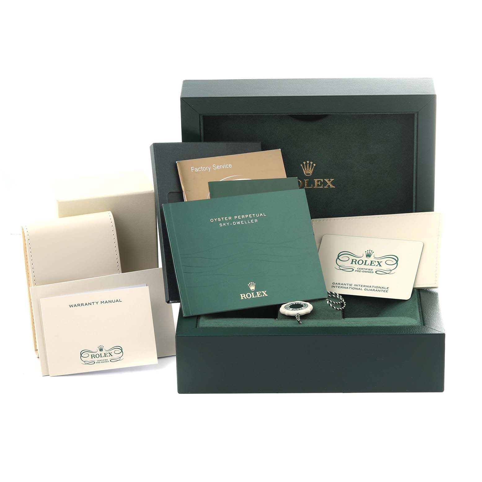 This image shows the Rolex Sky-Dweller 326135 Men
s Rose Gold Brown Dial 326135 Men
s Rose Gold Brown Dial watch packaging, including warranty manual, factory service booklets, and the watch case.