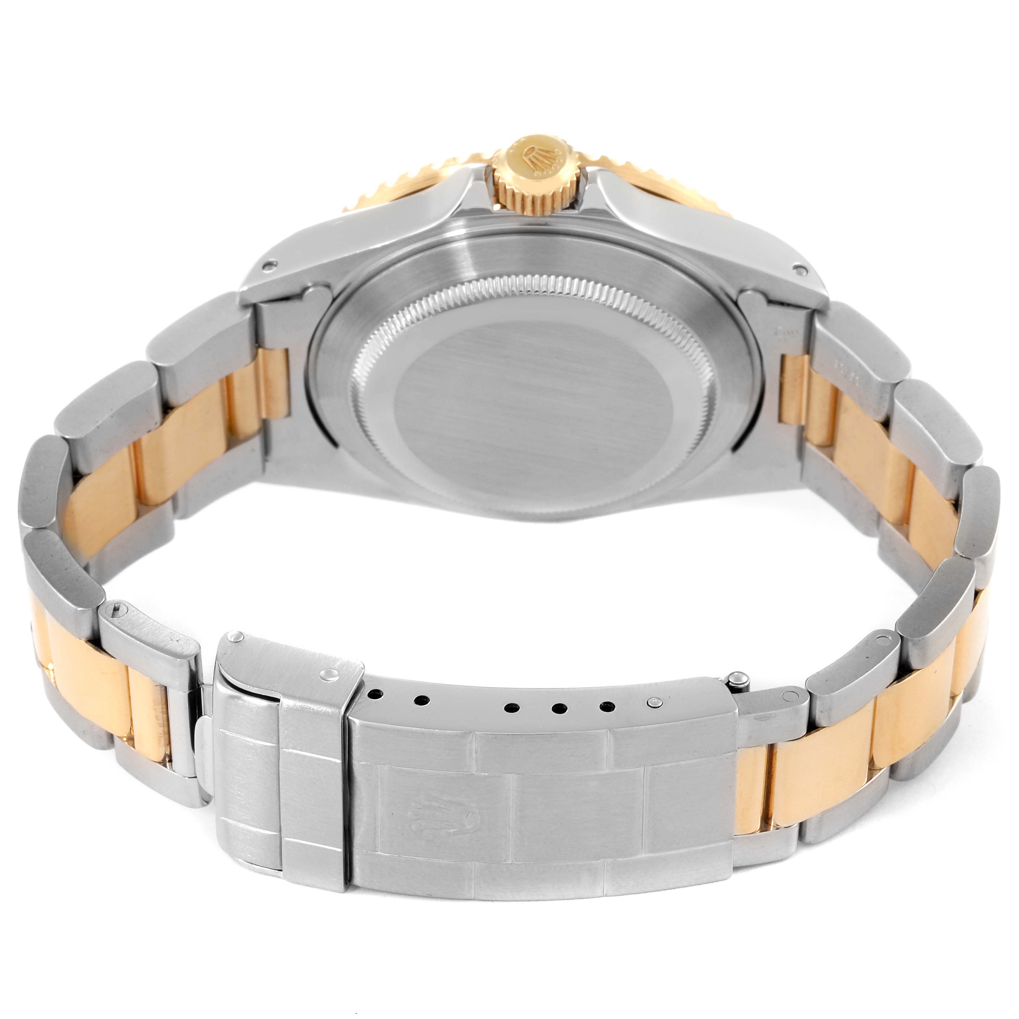 This image shows the back case and bracelet of a Rolex Submariner 16613 Men's Steel and Gold (two tone) Blue Dial 16613 Men's Steel and Gold (two tone) Blue Dial watch.