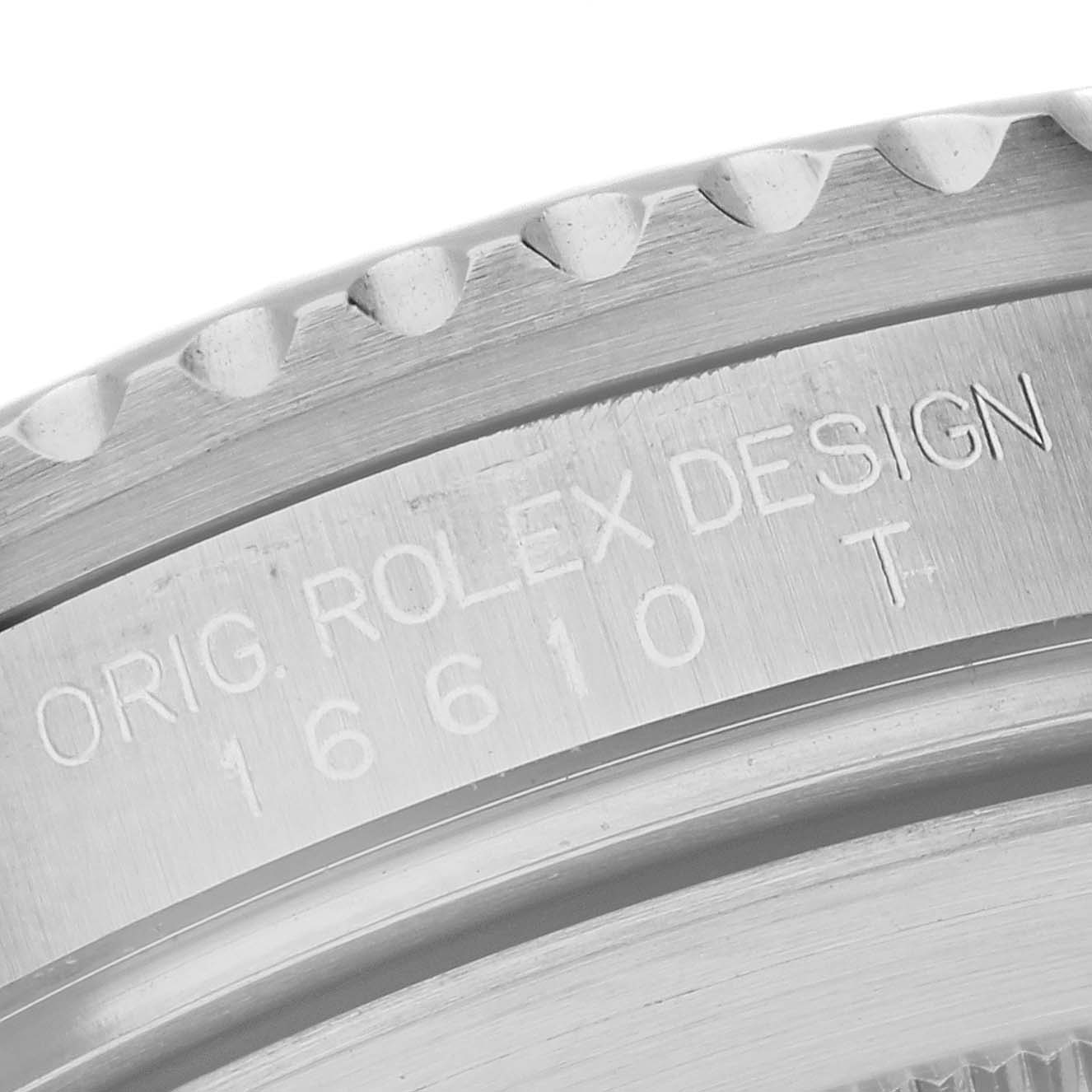 This close-up shows the engraved side of the bezel and case of a Rolex Submariner 16610 Men
s Stainless Steel Black Dial 16610 Men
s Stainless Steel Black Dial, model number 16610 T.