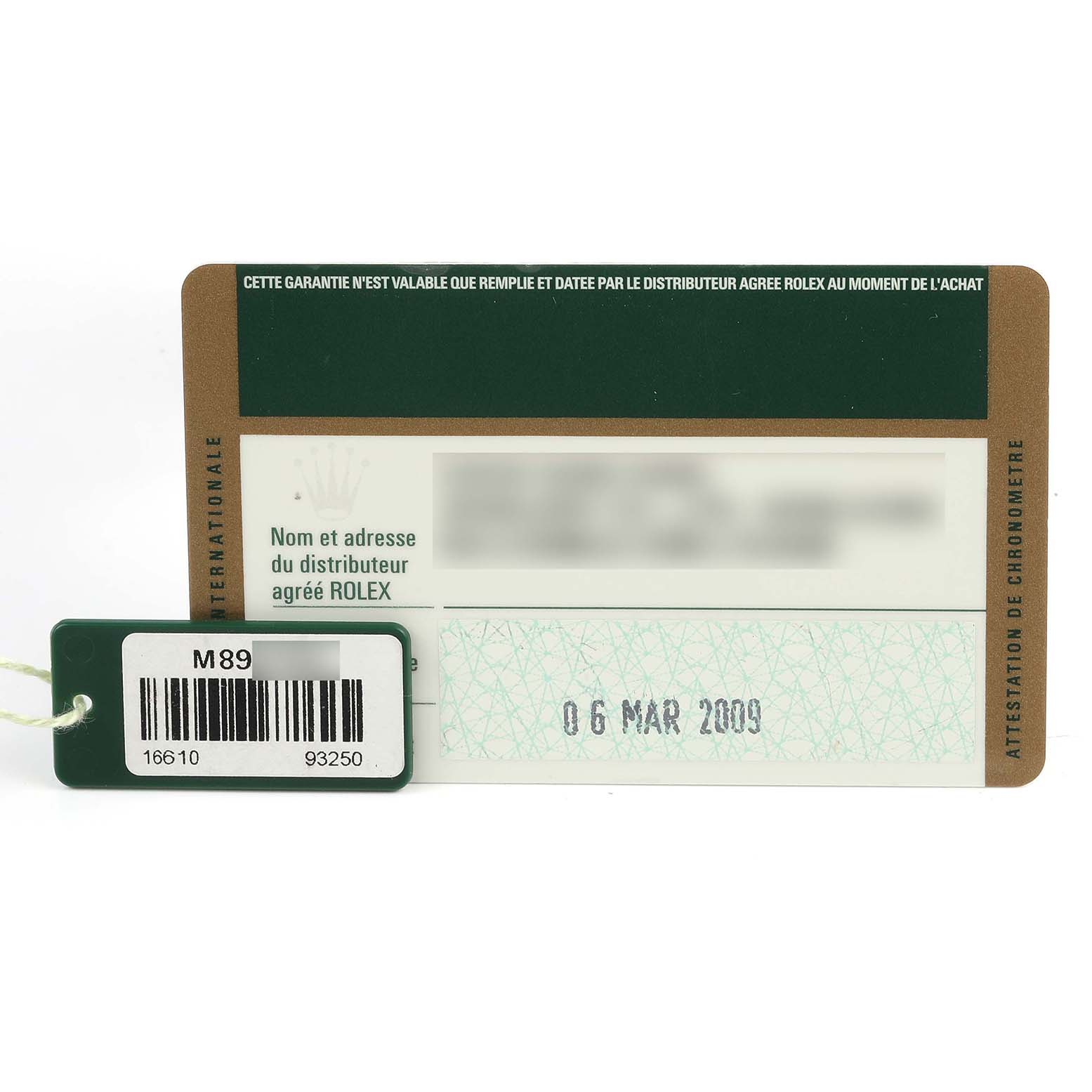 The image shows a warranty card and tag for a Rolex Submariner 16610 Men
s Stainless Steel Black Dial 16610 Men
s Stainless Steel Black Dial watch.