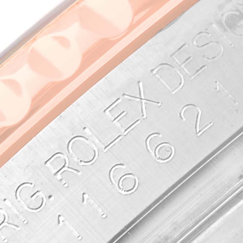 The image shows a close-up of the engraved case side and edge of the bezel of the Rolex Yacht-Master 116621 Men's Steel and Gold (two tone) Black Dial 116621 Men's Steel and Gold (two tone) Black Dial watch.