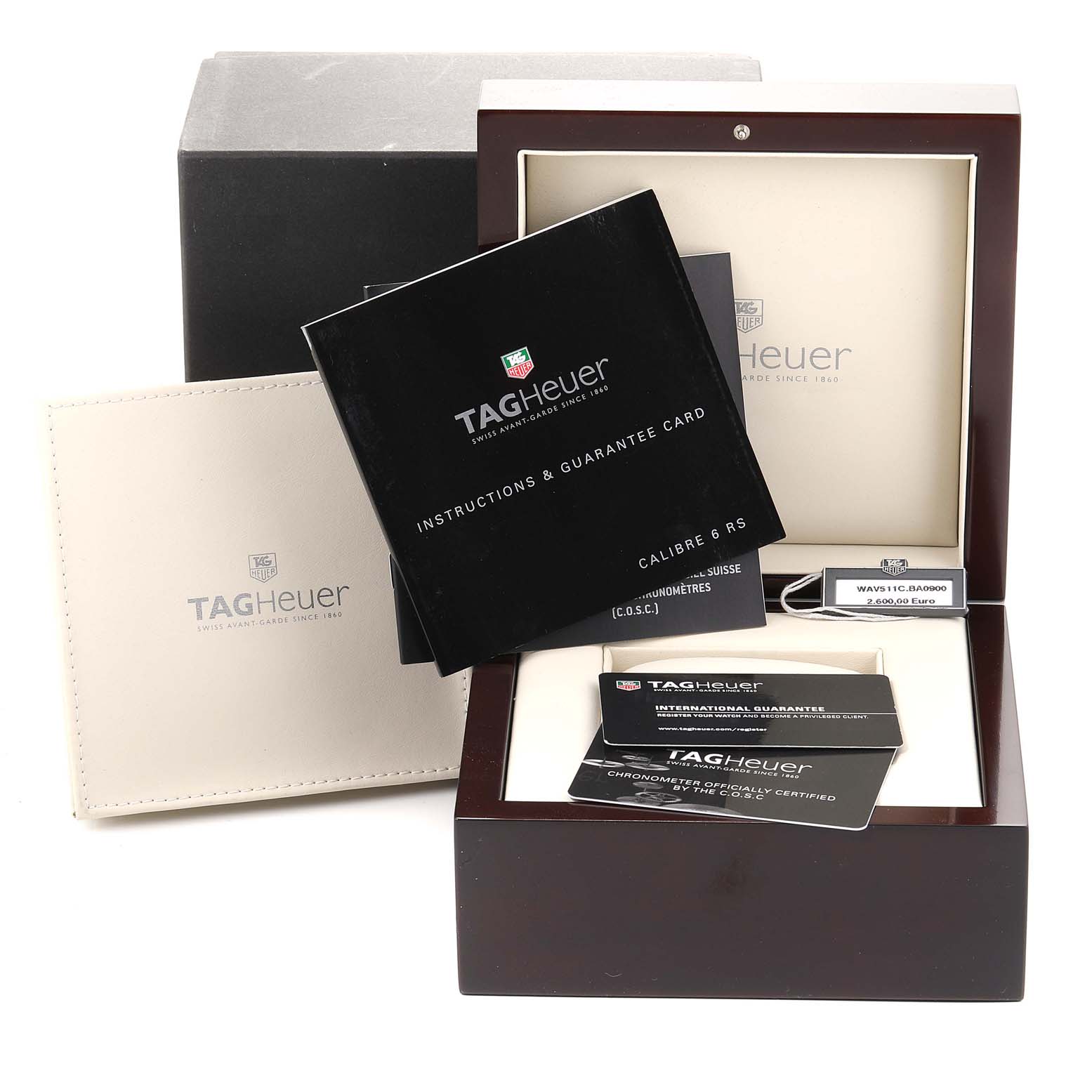 The image shows the packaging and accessories for the Tag Heuer Carrera WAV511C.BA0900 Men's Stainless Steel Brown Dial WAV511C.BA0900 Men's Stainless Steel Brown Dial, including a box, manuals, and guarantee cards.