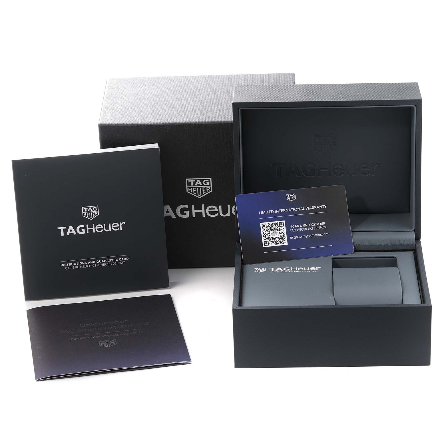 The image shows the packaging, warranty card, and instruction booklets for a Tag Heuer Carrera CBG2010 Men's Stainless Steel Transparent Dial CBG2010 Men's Stainless Steel Transparent Dial model, viewed from the front.