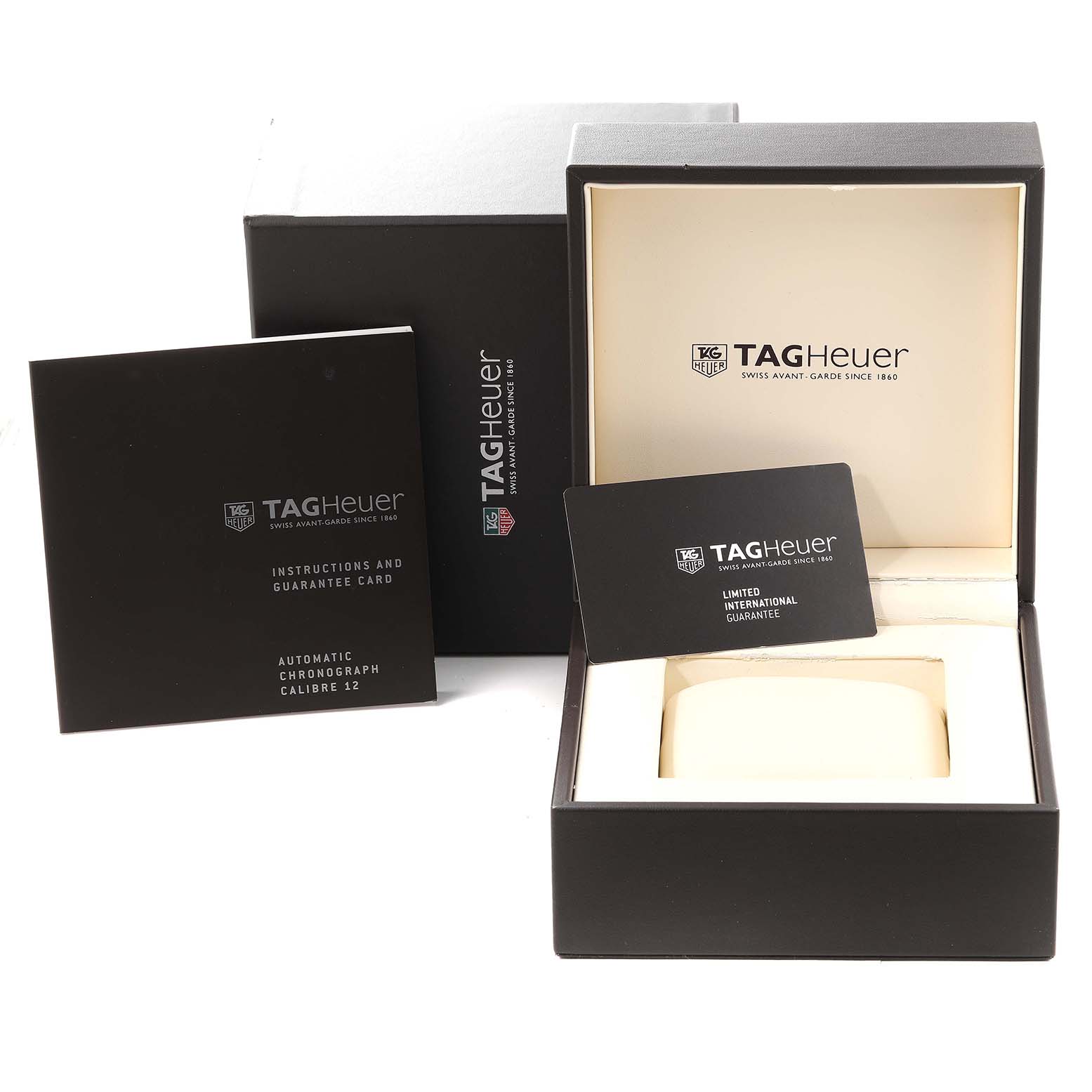 The image shows the packaging, instruction manual, and guarantee card for the Limited Edition Tag Heuer watch.